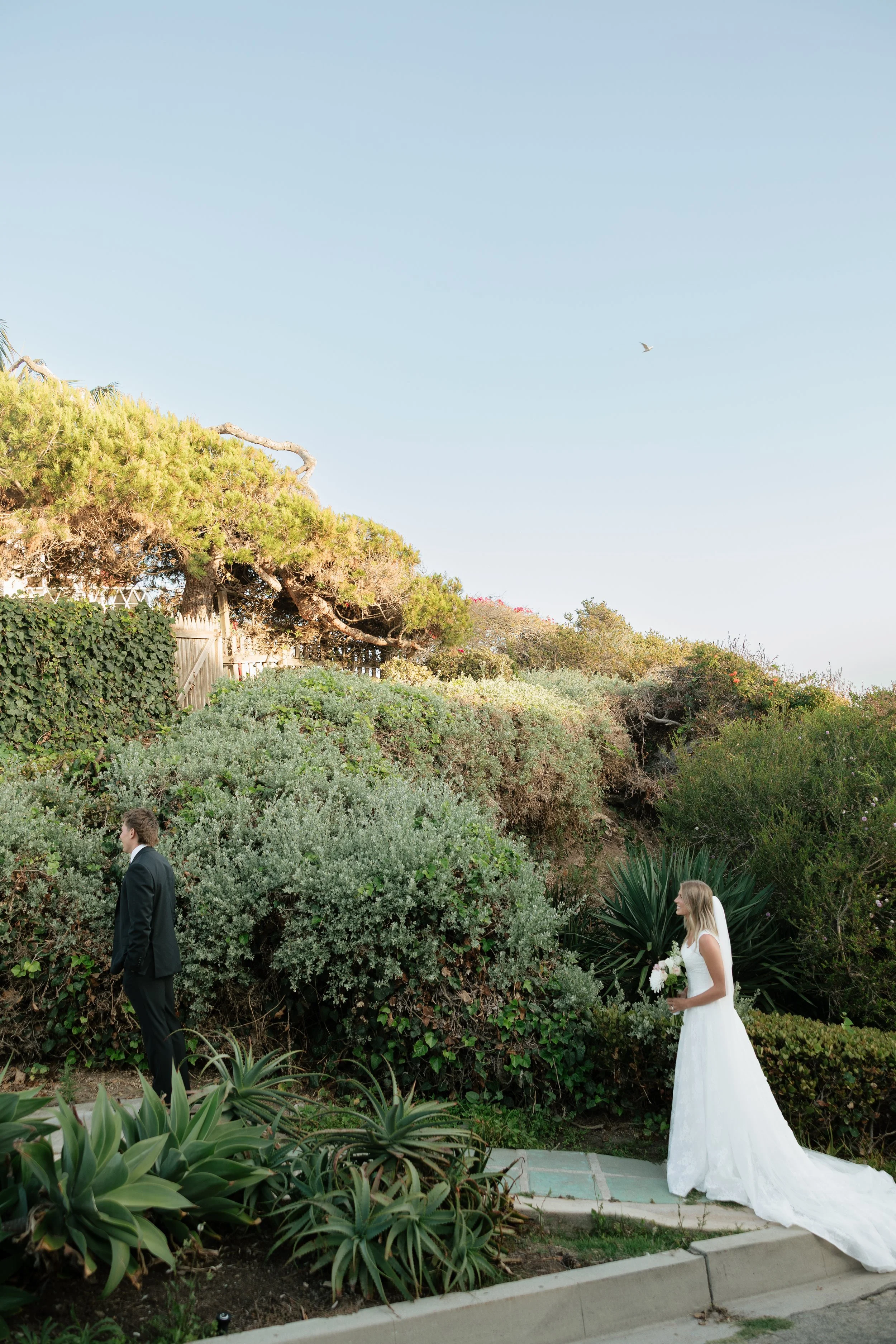 laguna beach wedding photographer capturing a first look between bride and groom