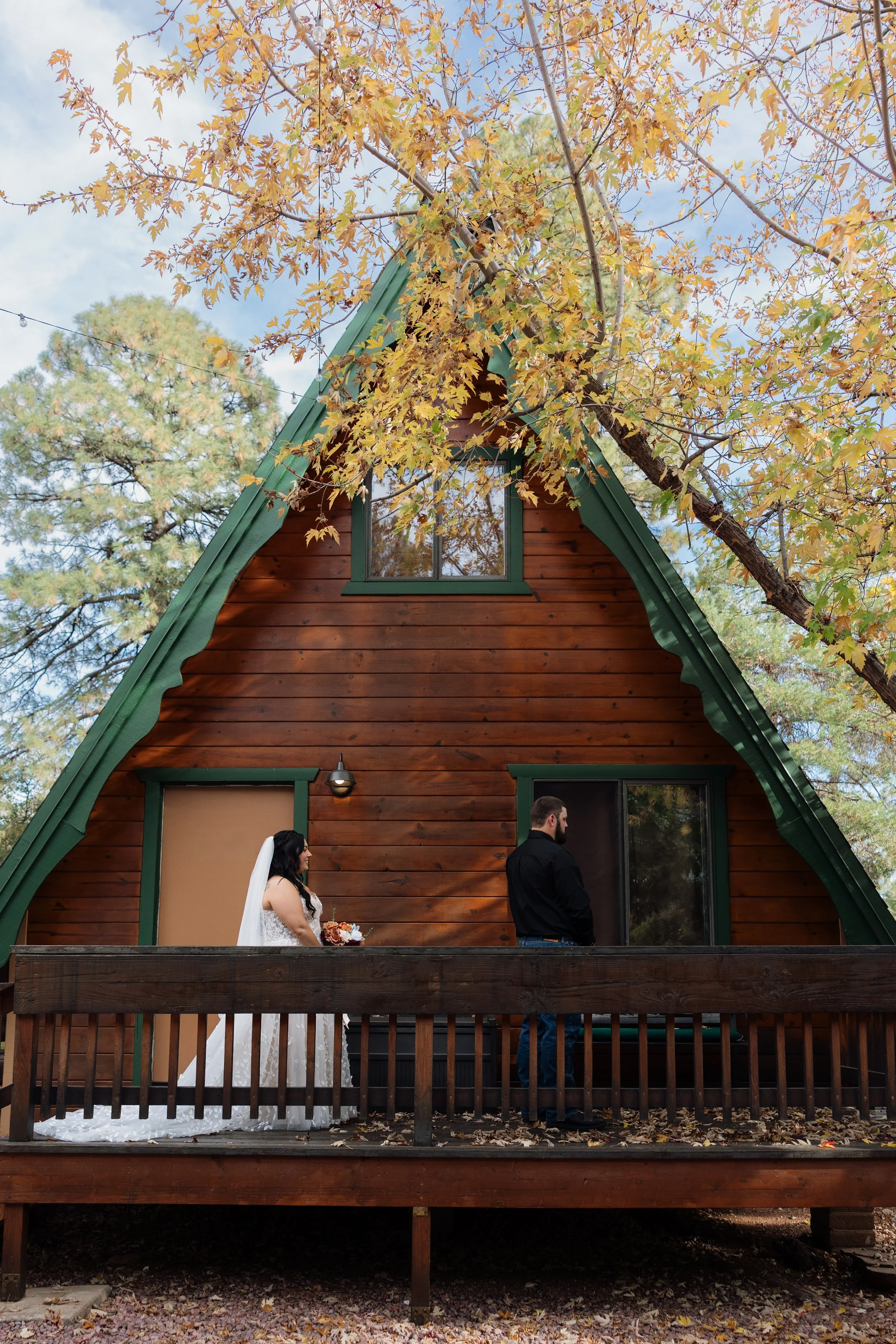 bride and groom having a first look on the porch of a cabin at the cabins on strawberry hill