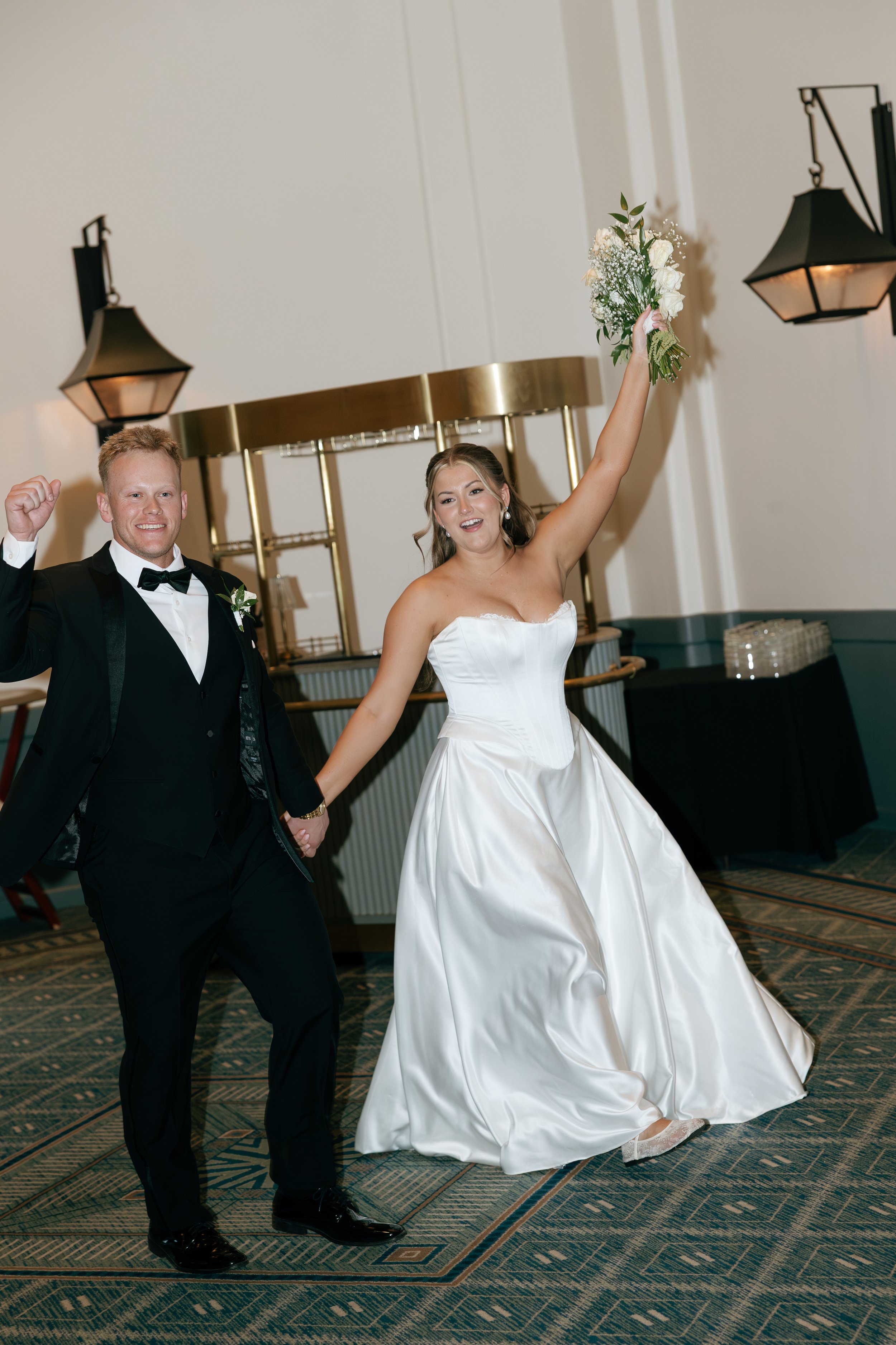 Bride and groom making their grand entrance into wedding reception at The Scott Resort & Spa in Scottsdale, Arizona