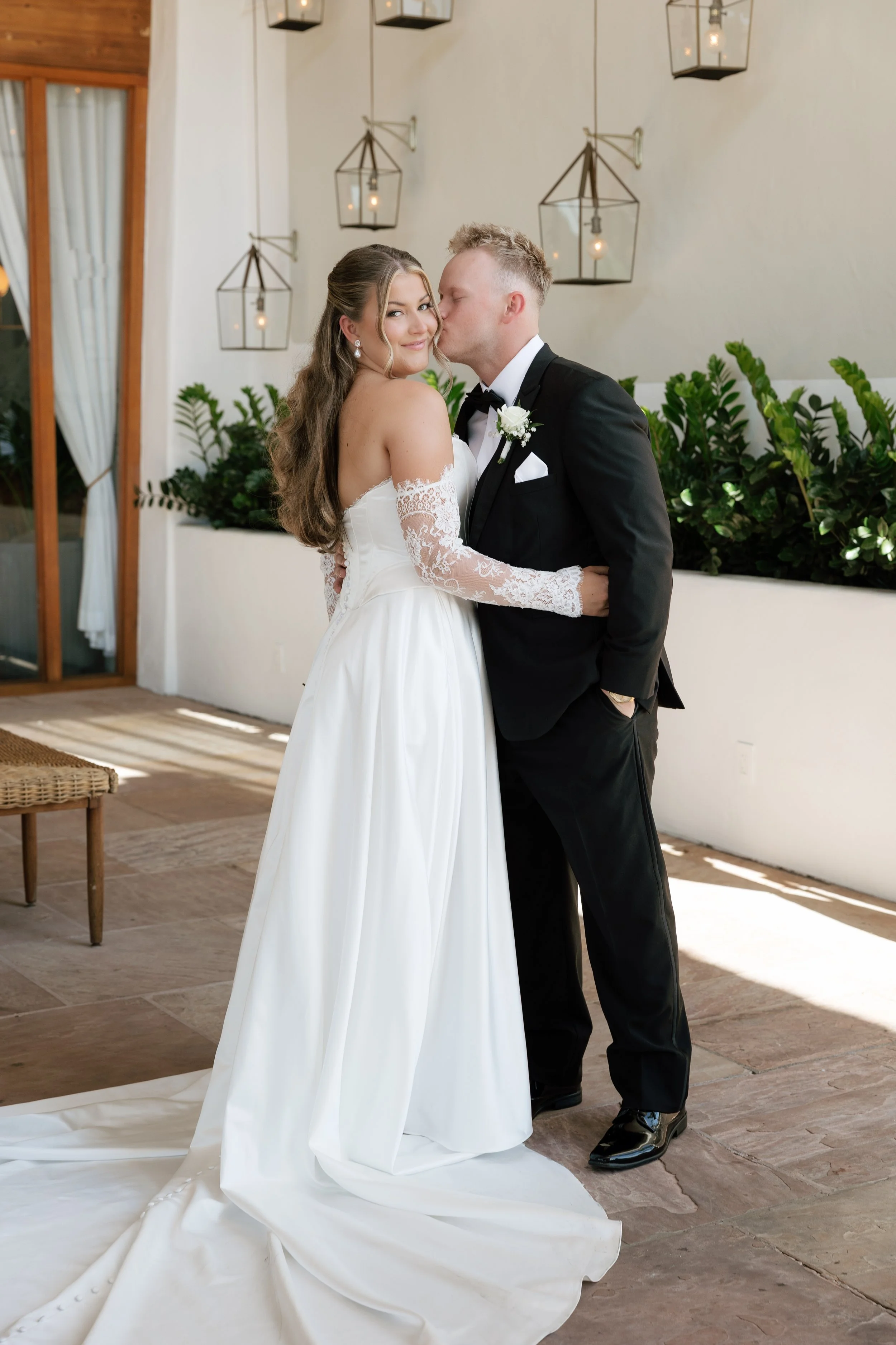 Bride and groom embracing during wedding portraits at The Scott Resort & Spa