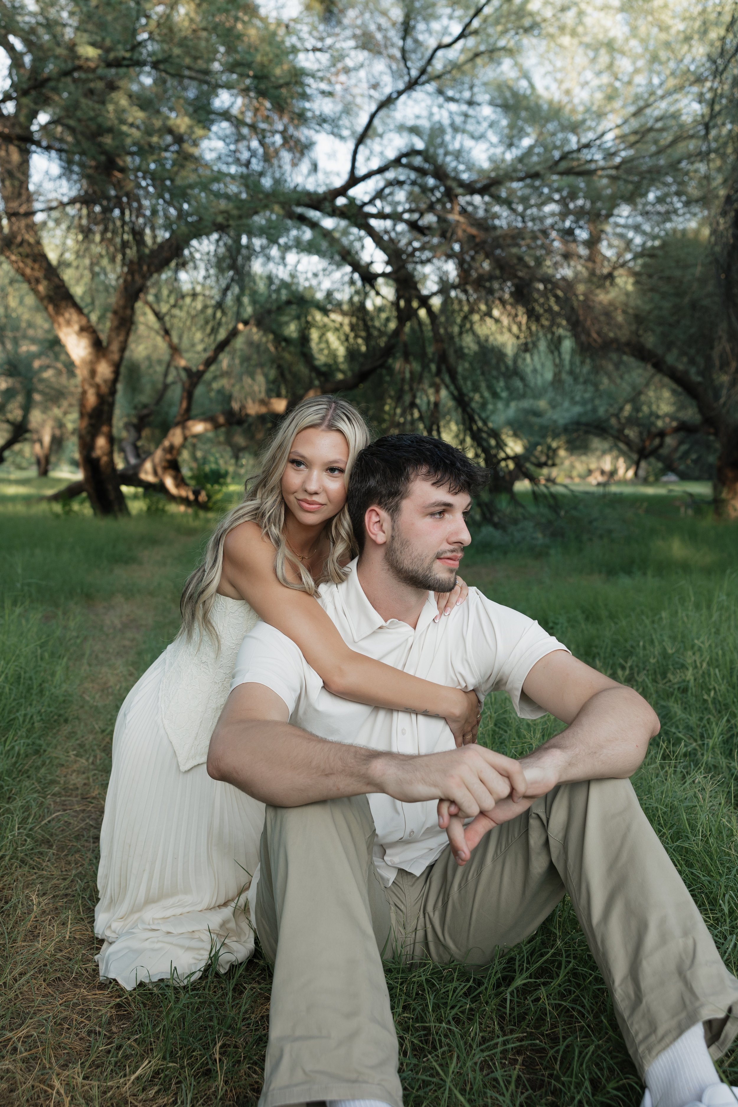 engaged couple photoshoot in green field in arizona