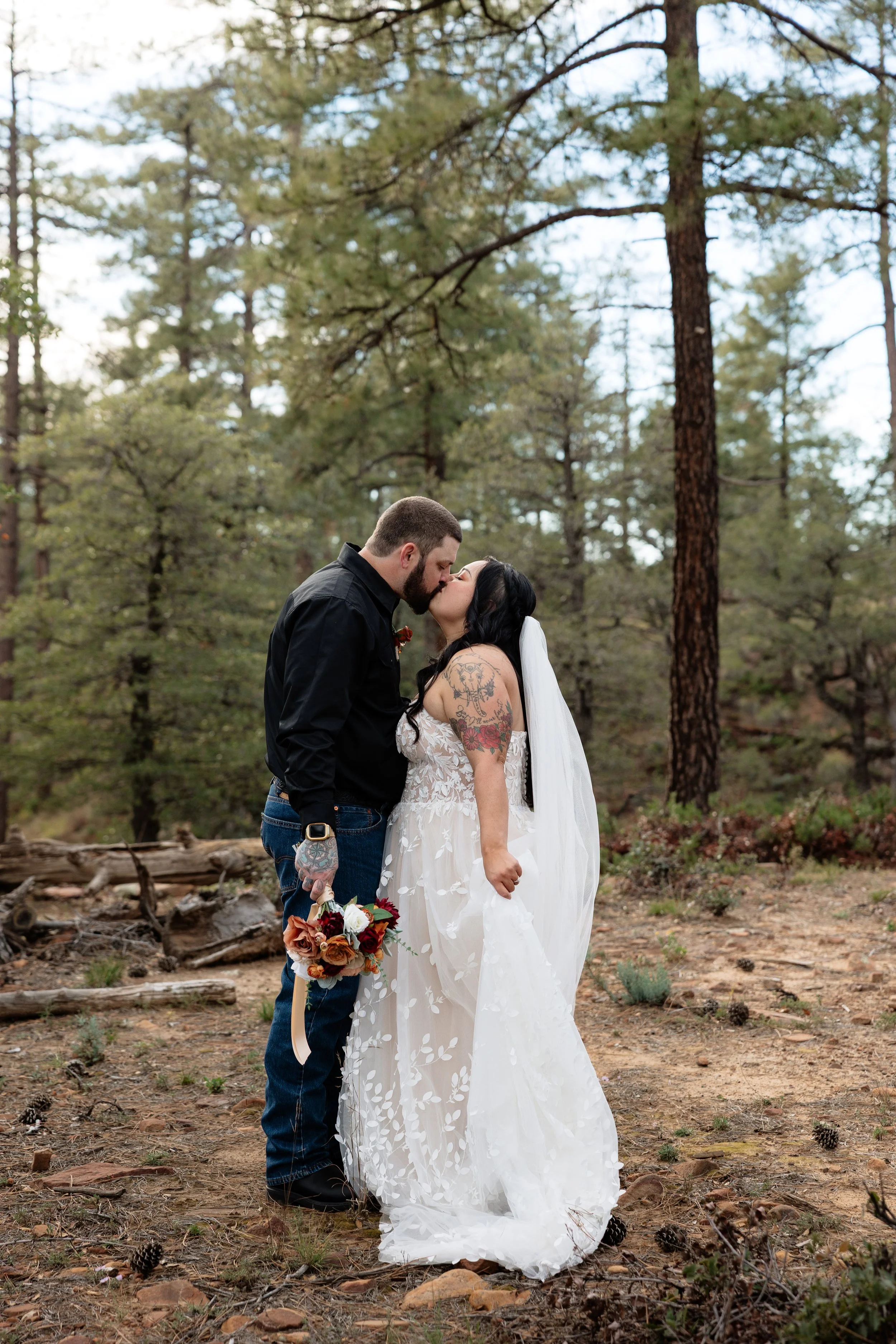 oregon wedding photographer with newlyweds in pine trees during fall