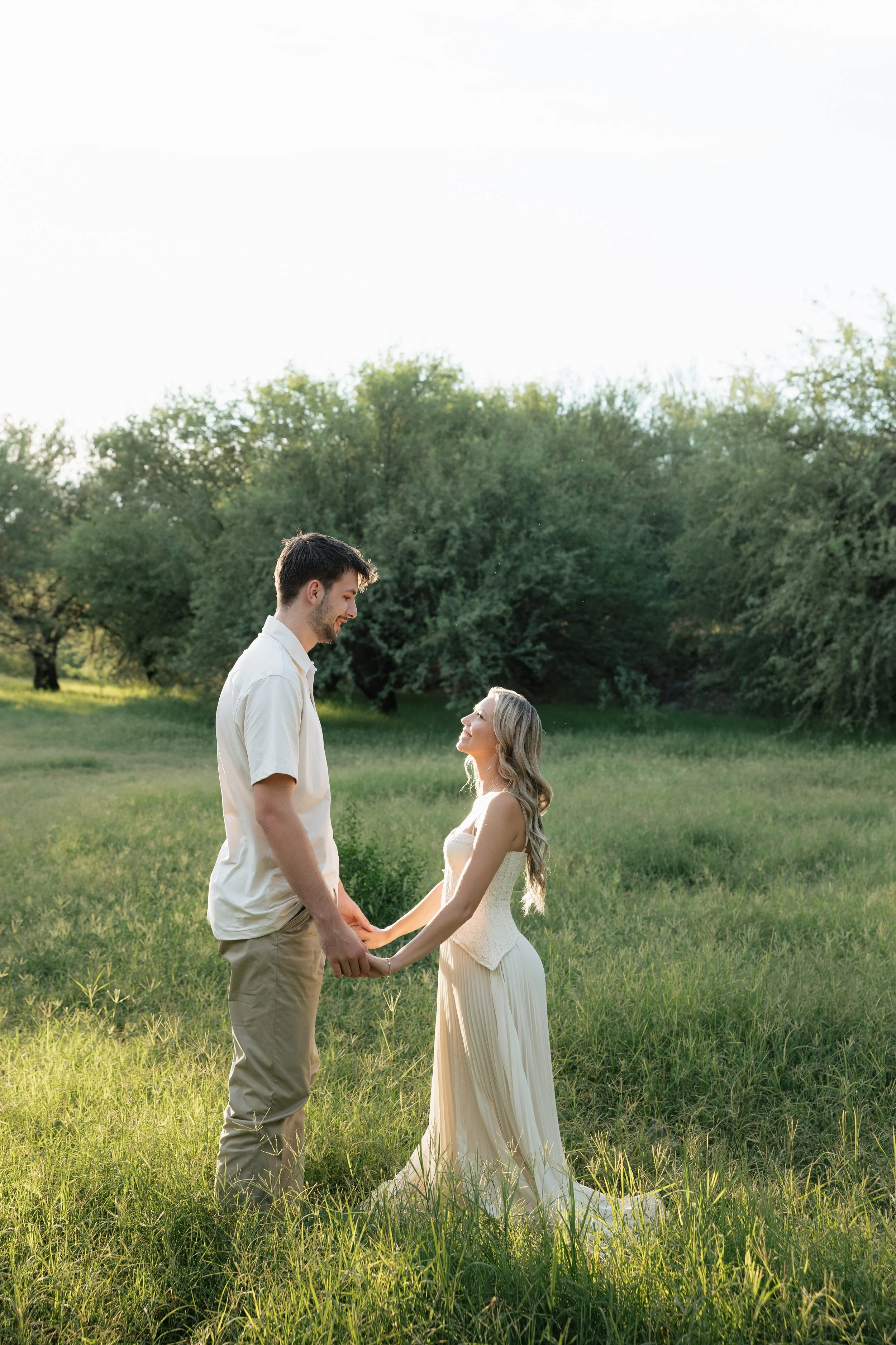 newly engaged couple posing for engagement photos at saguaro lake arizona
