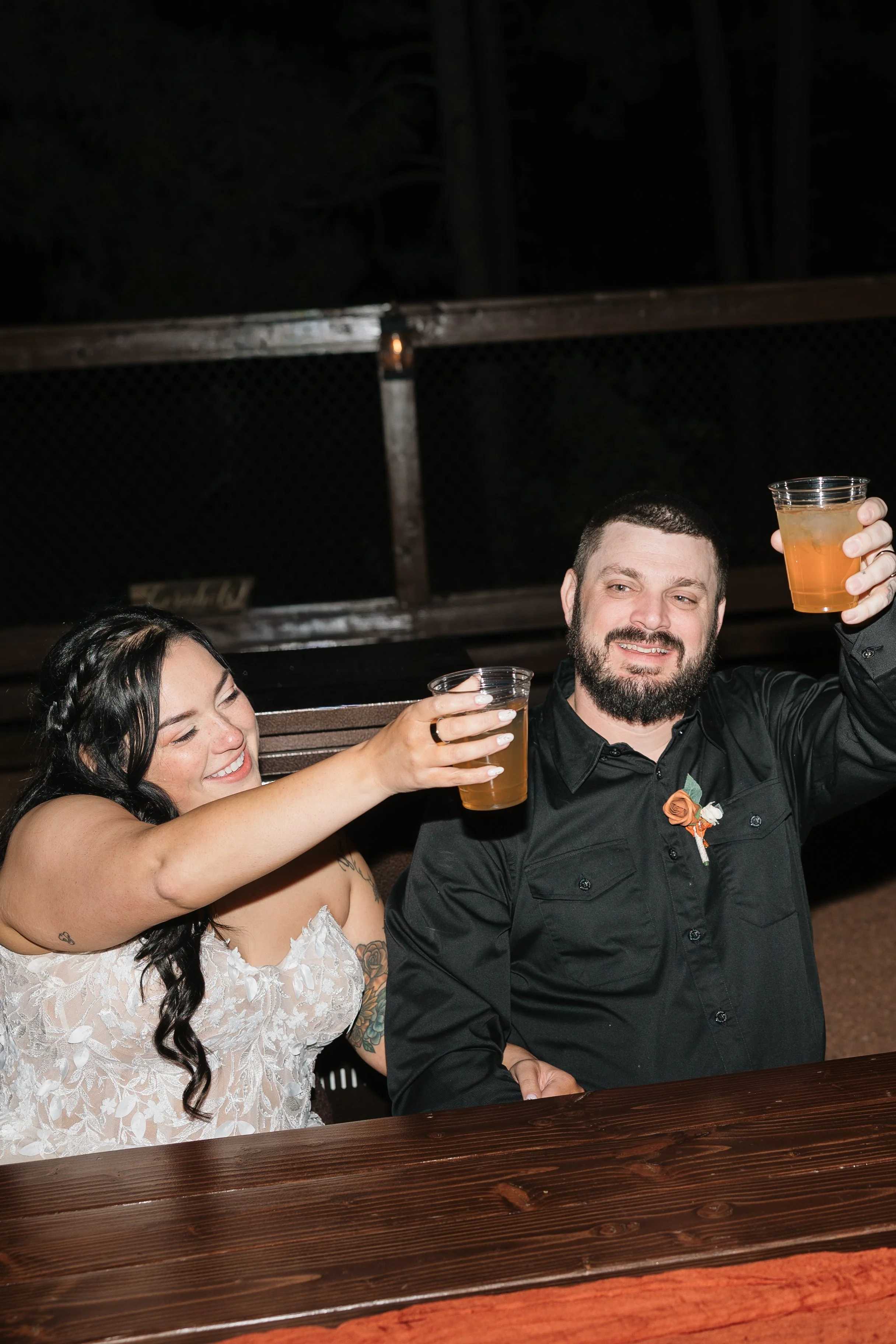 wedding reception with a bride and groom toasting to marriage