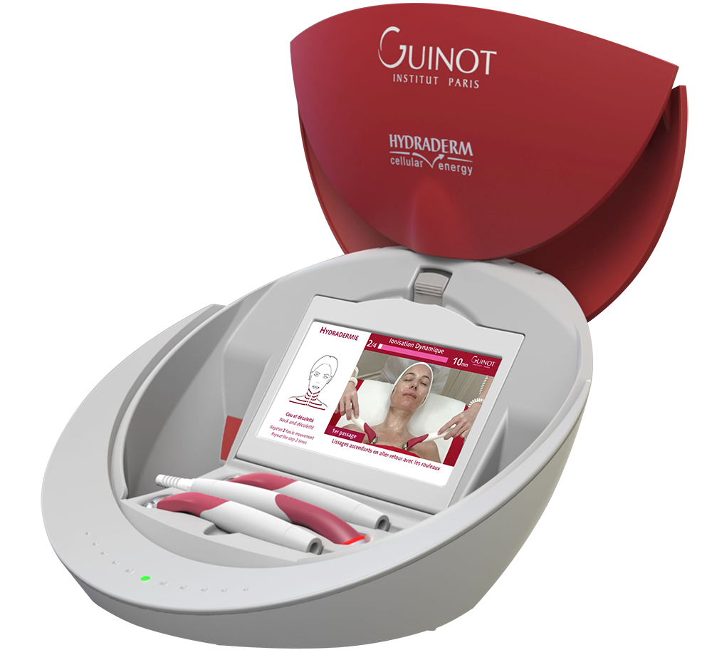 A medical or aesthetic device with a screen displaying instructions and a woman receiving treatment on her face, branded with "GUINOT Institut Paris" and "Hydraderm cellular energy".