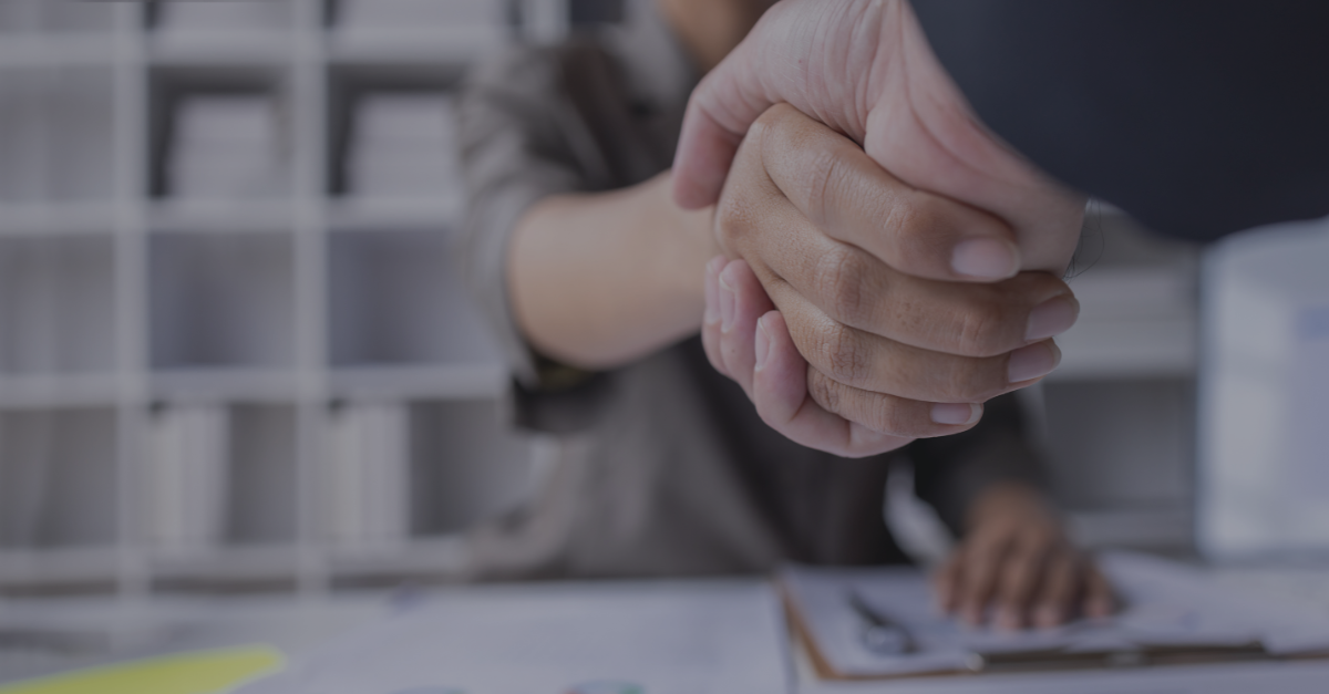 Two veterinarian professionals shaking hands