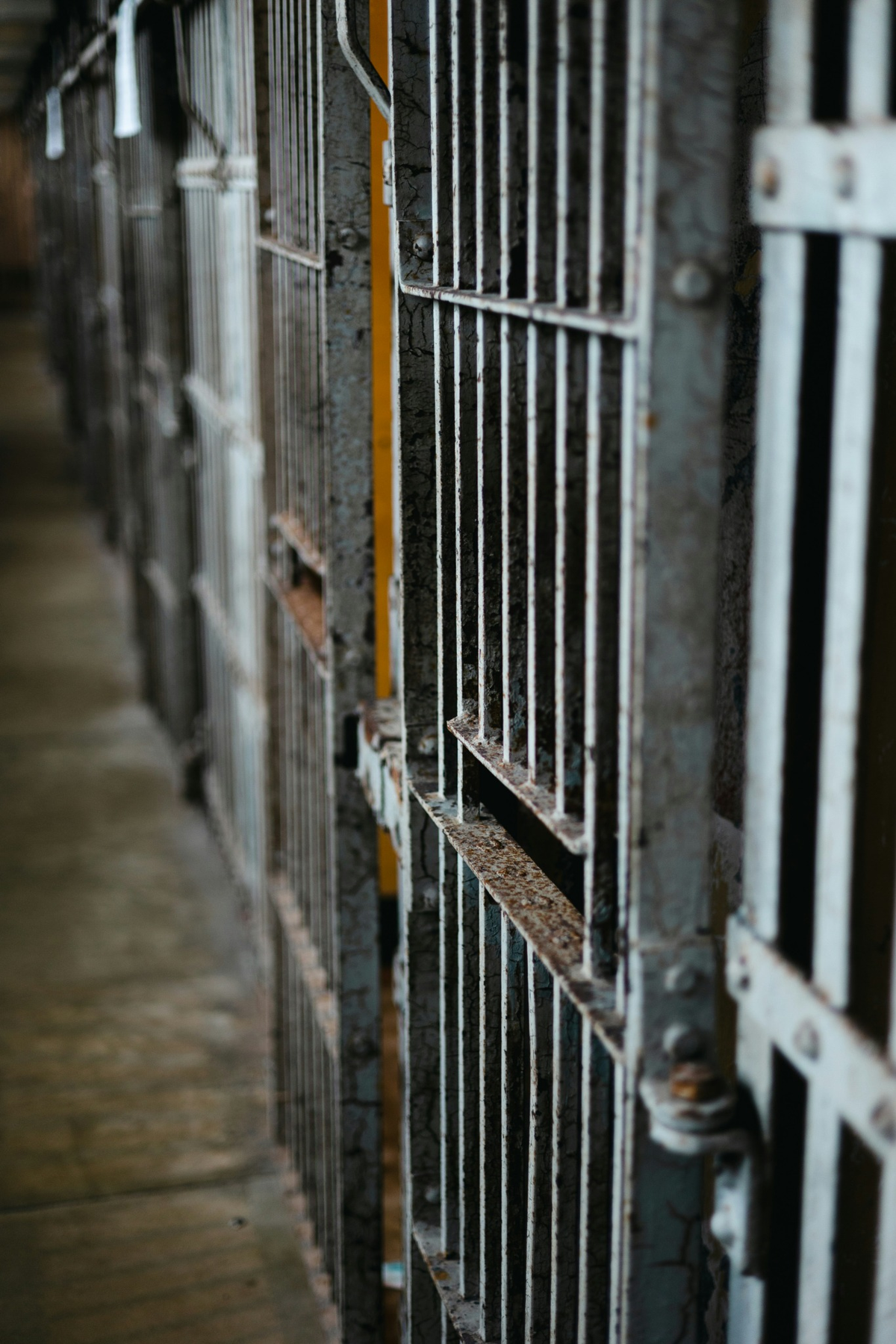 Utah jail cell bars in a detention facility representing the risk of incarceration in criminal cases and the need for criminal defense representation