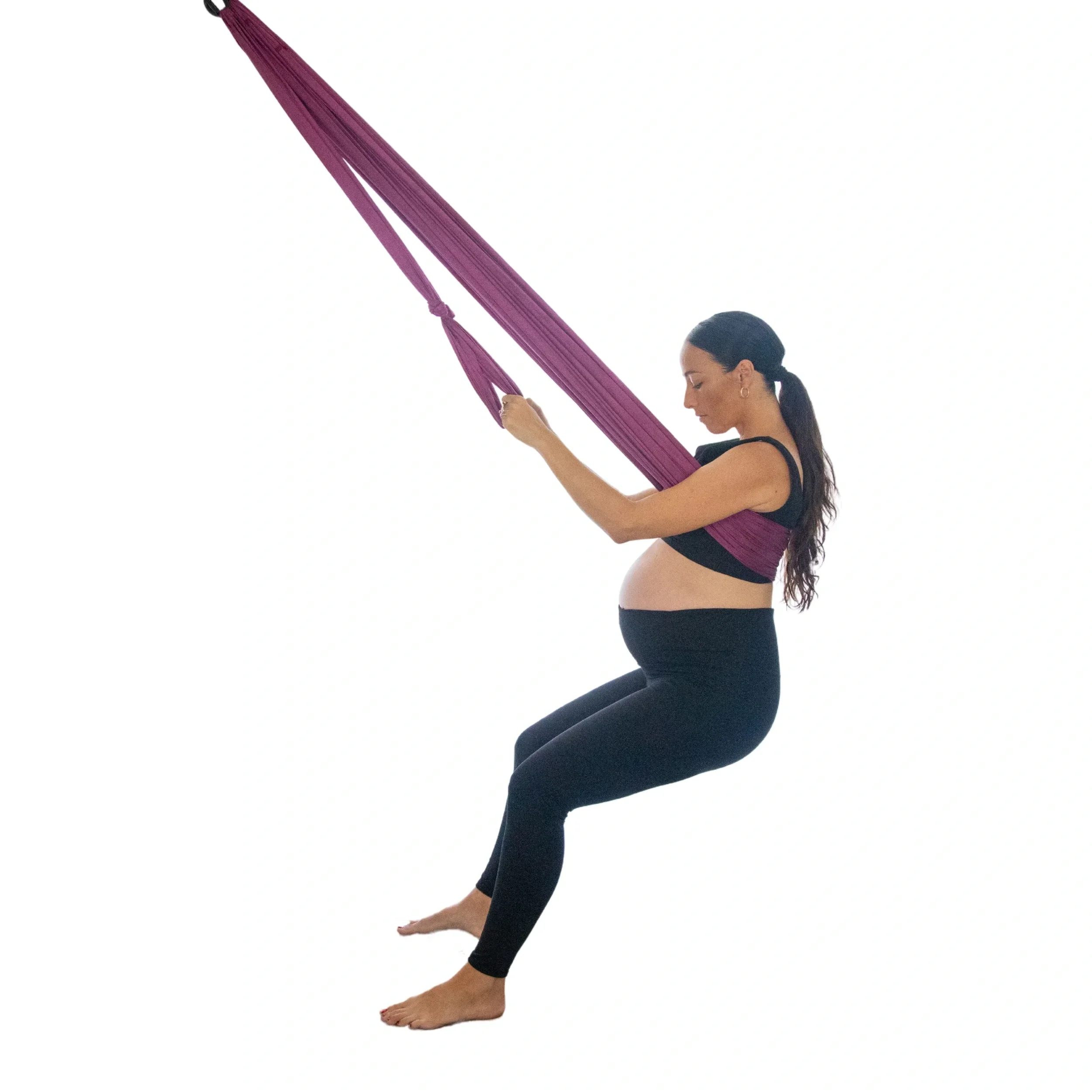 Pregnant person using the Birth Sling by Dr Jess Michaels — a pregnancy support and birthing aid available to hire through Lyddie Doula, South East London