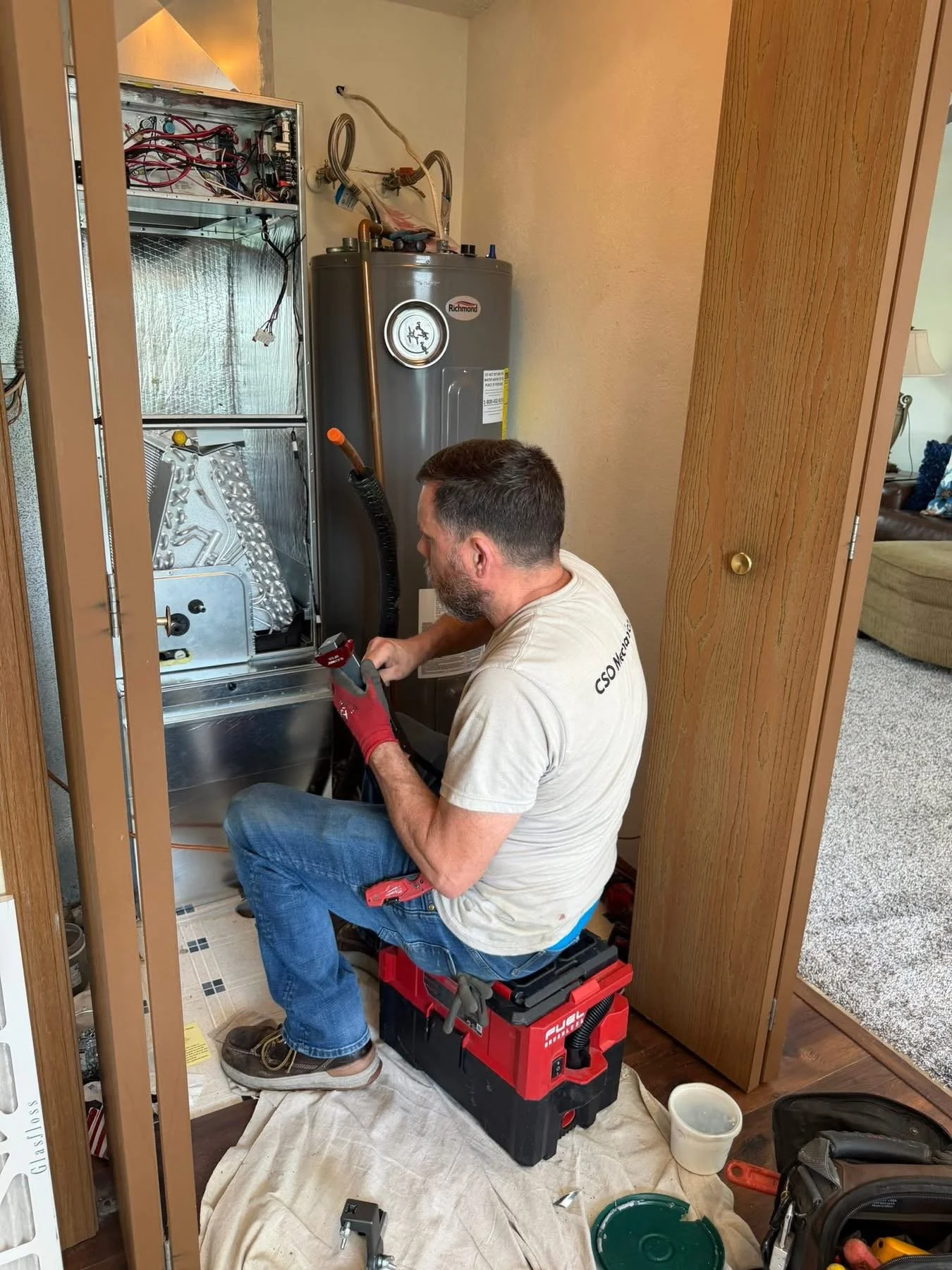 HVAC technician fixing a furnace