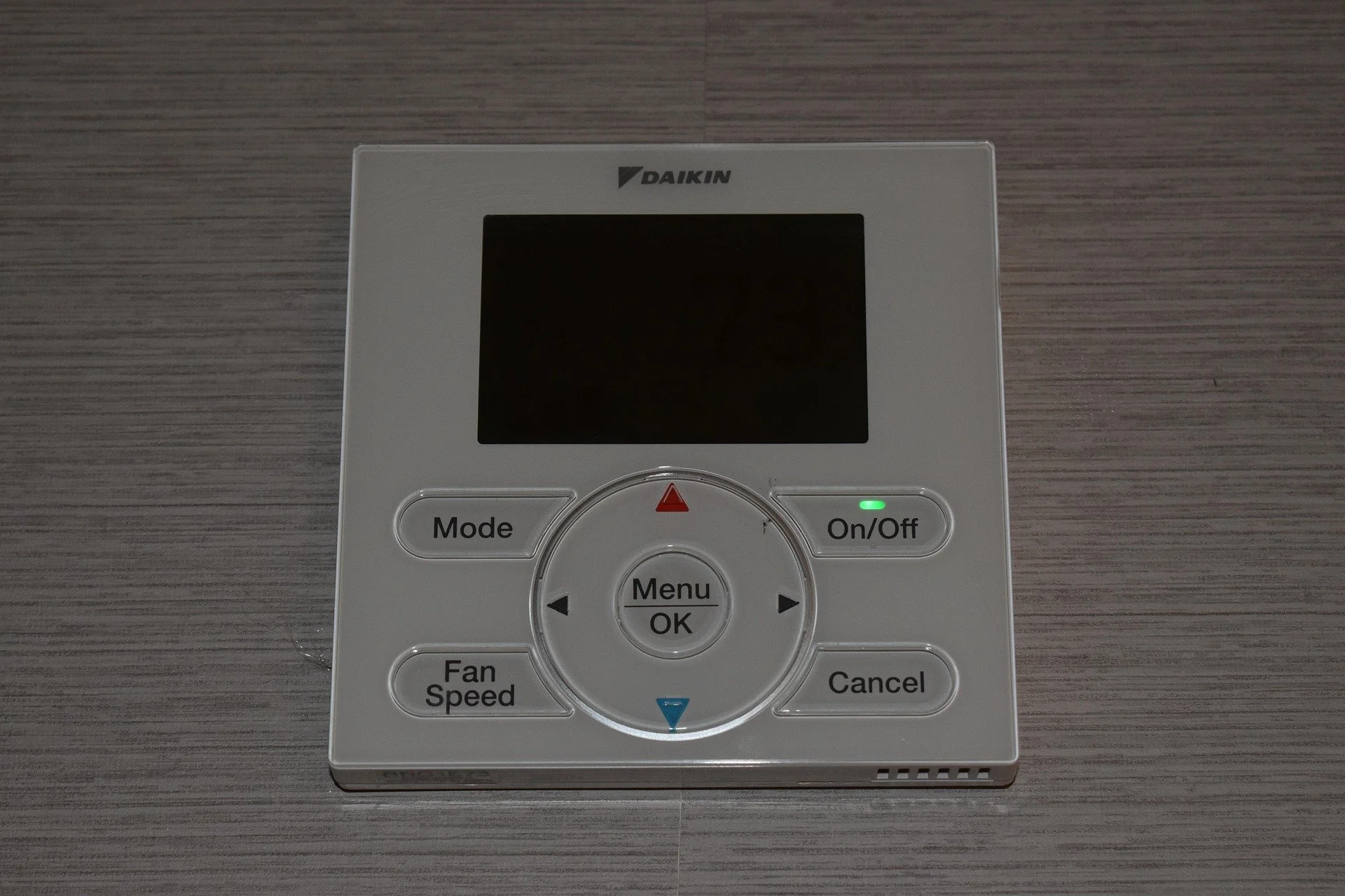 Smart thermostat displaying 78 degrees Fahrenheit in modern home