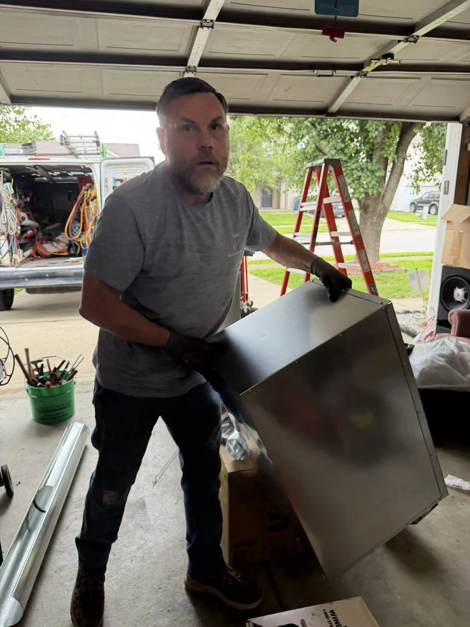 HVAC technician installing a new furnace.