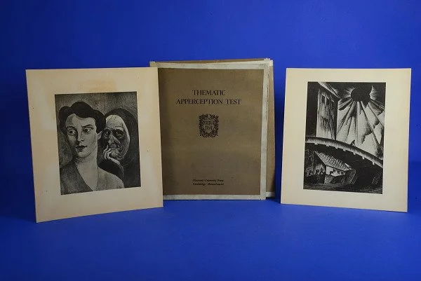 The original Thematic Apperception Test (TAT) cards and manual by Henry Murray. This visual represents the psychological foundation of Visual Intelligence: that we see the world as we are, not as it is