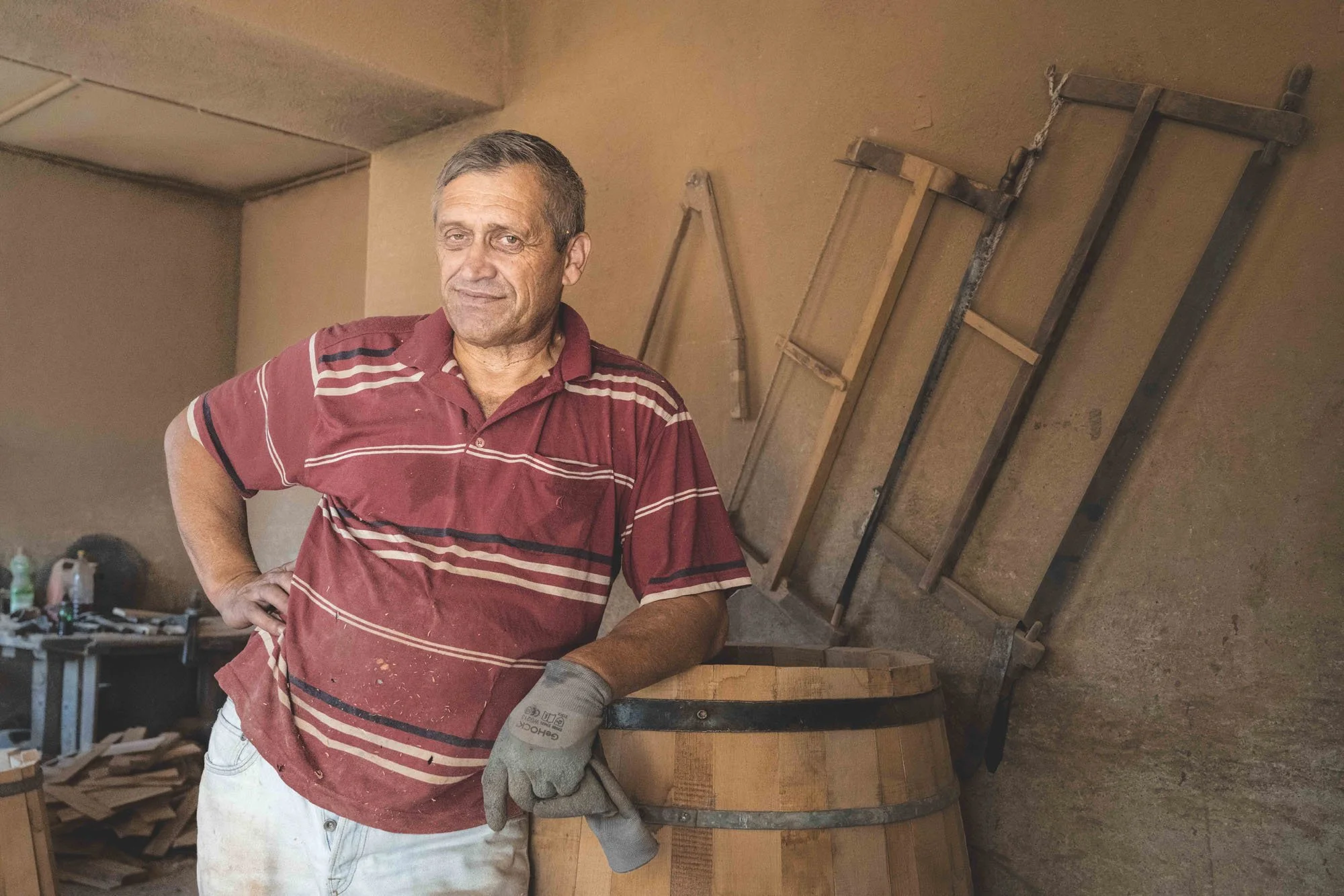 An environmental portrait of an older man in a traditional workshop in Montenegro. This image serves as a study in 'Projective Photography,' where the observer's internal state dictates the narrative of the subject