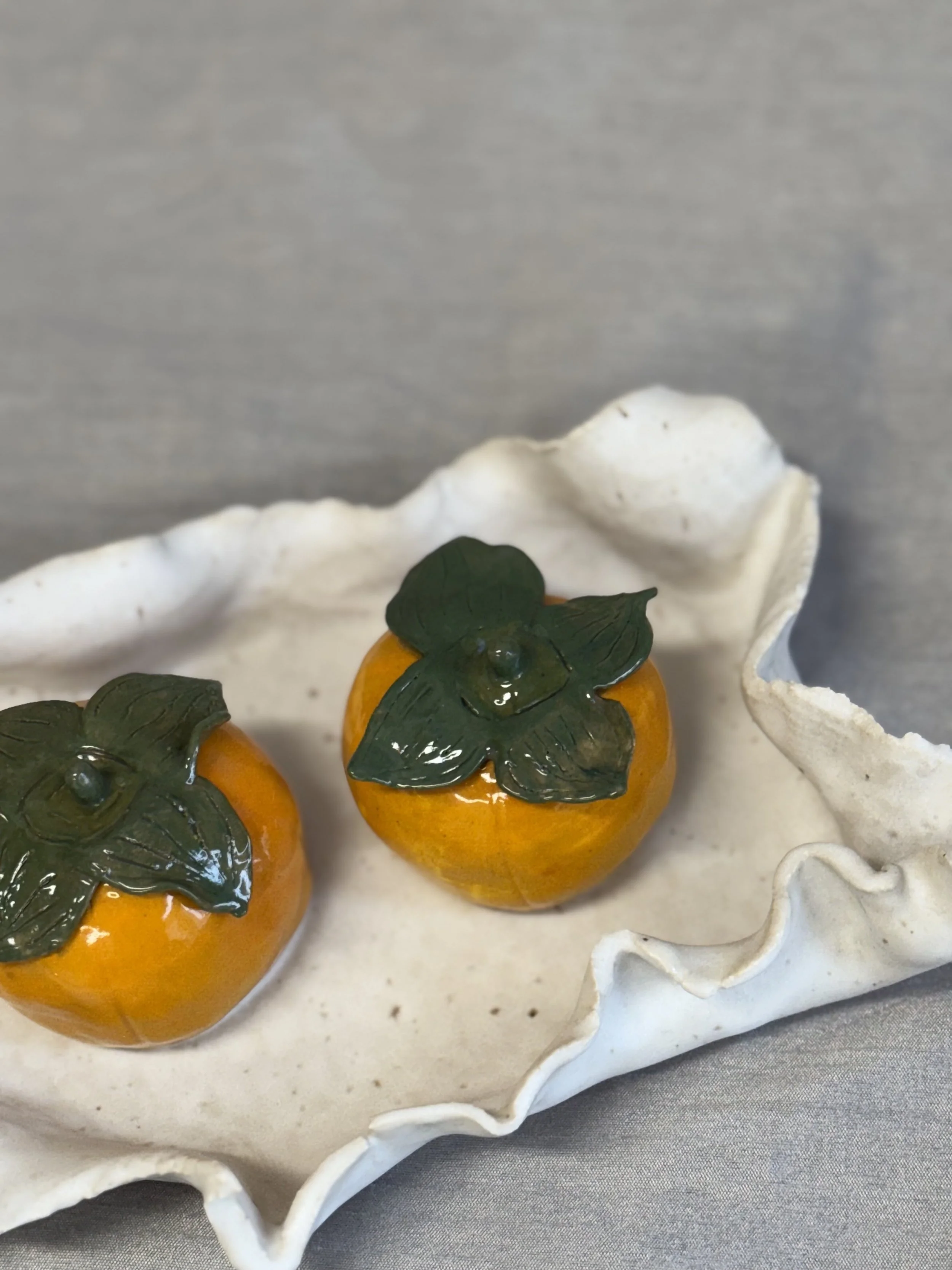 Persimmons in a Napkin (ceramic, 2025)