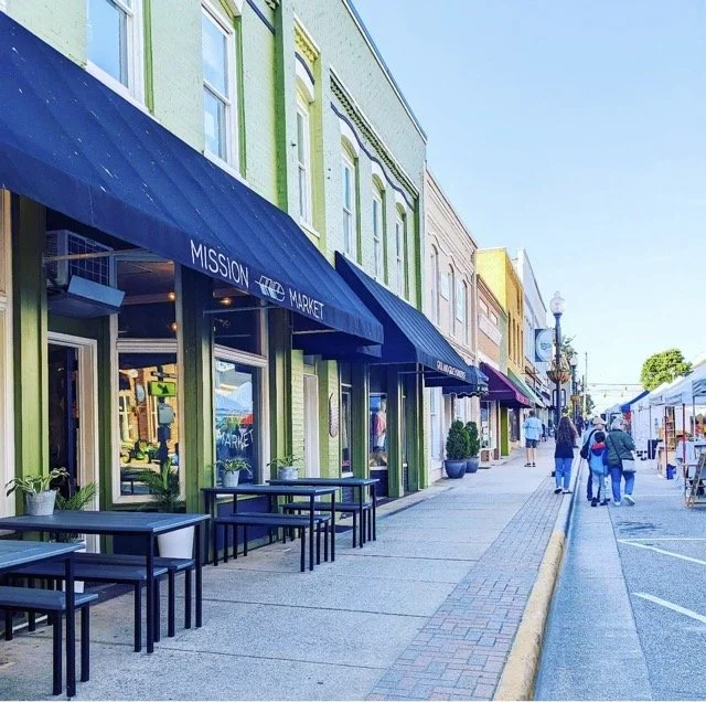 The sidewalk and storefronts in downtown Apex