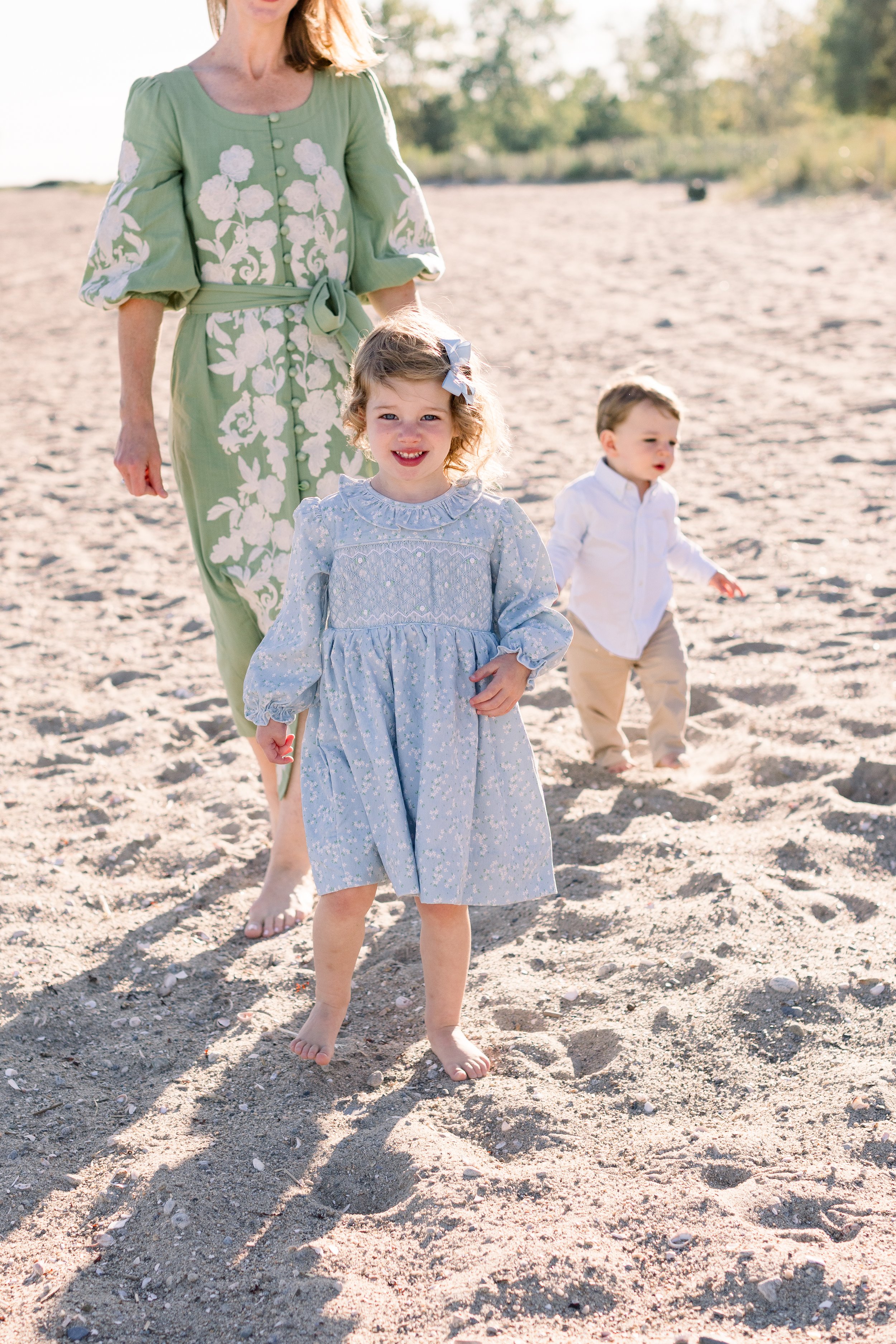 Kids running on the beach during a family photo shoot in East Hampton