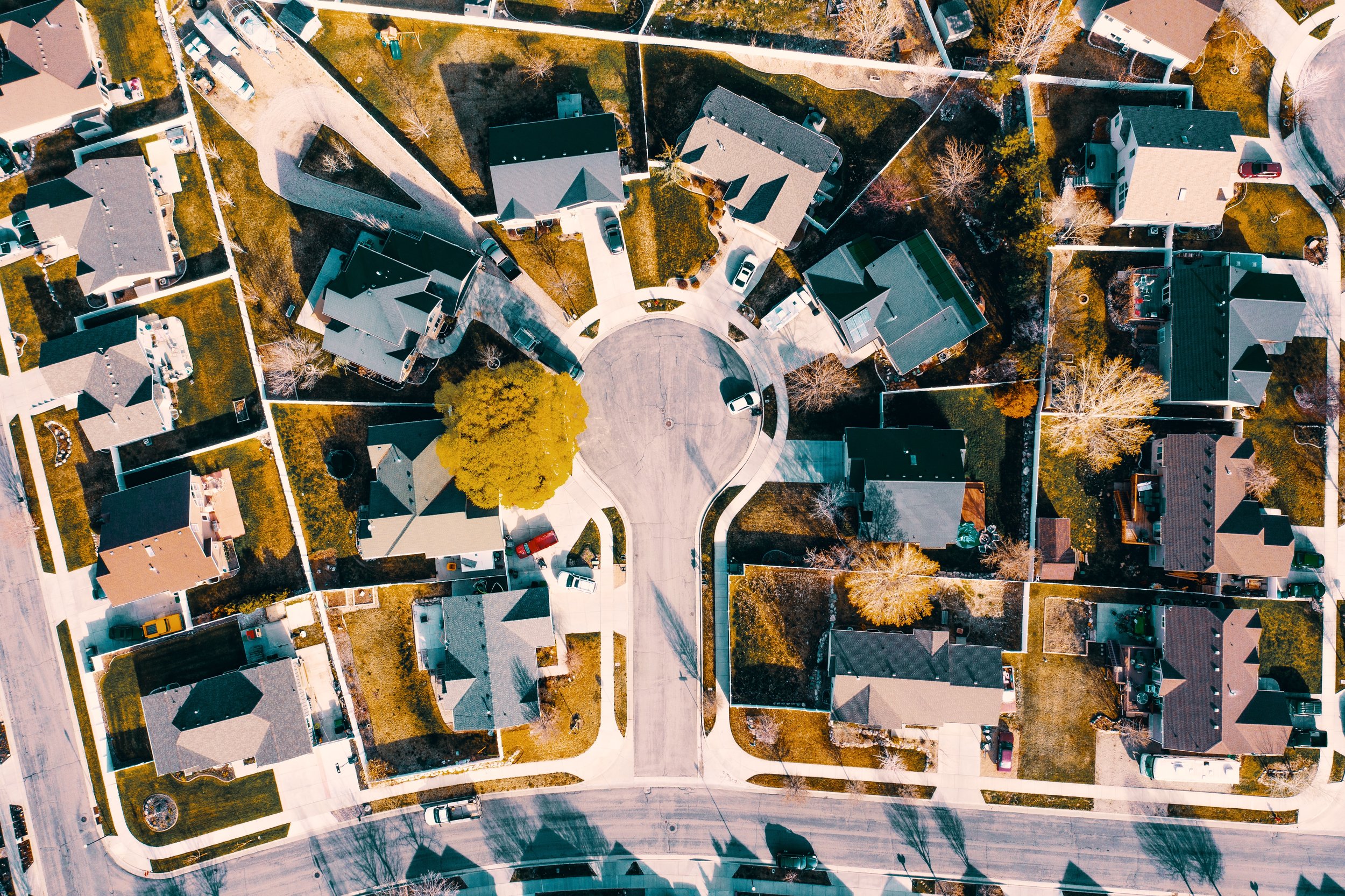 Aerial view of houses in a neighborhood cul-de-sac.