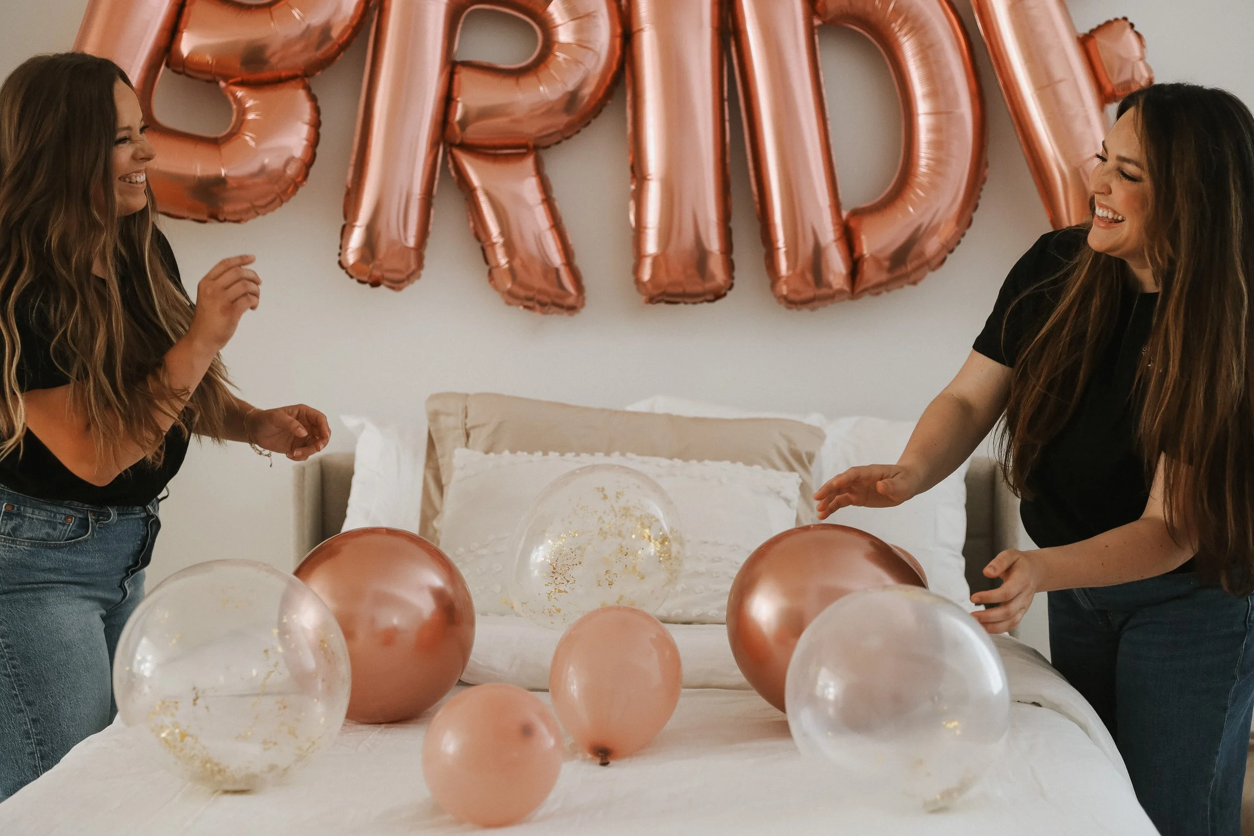 a bed with balloons on it
