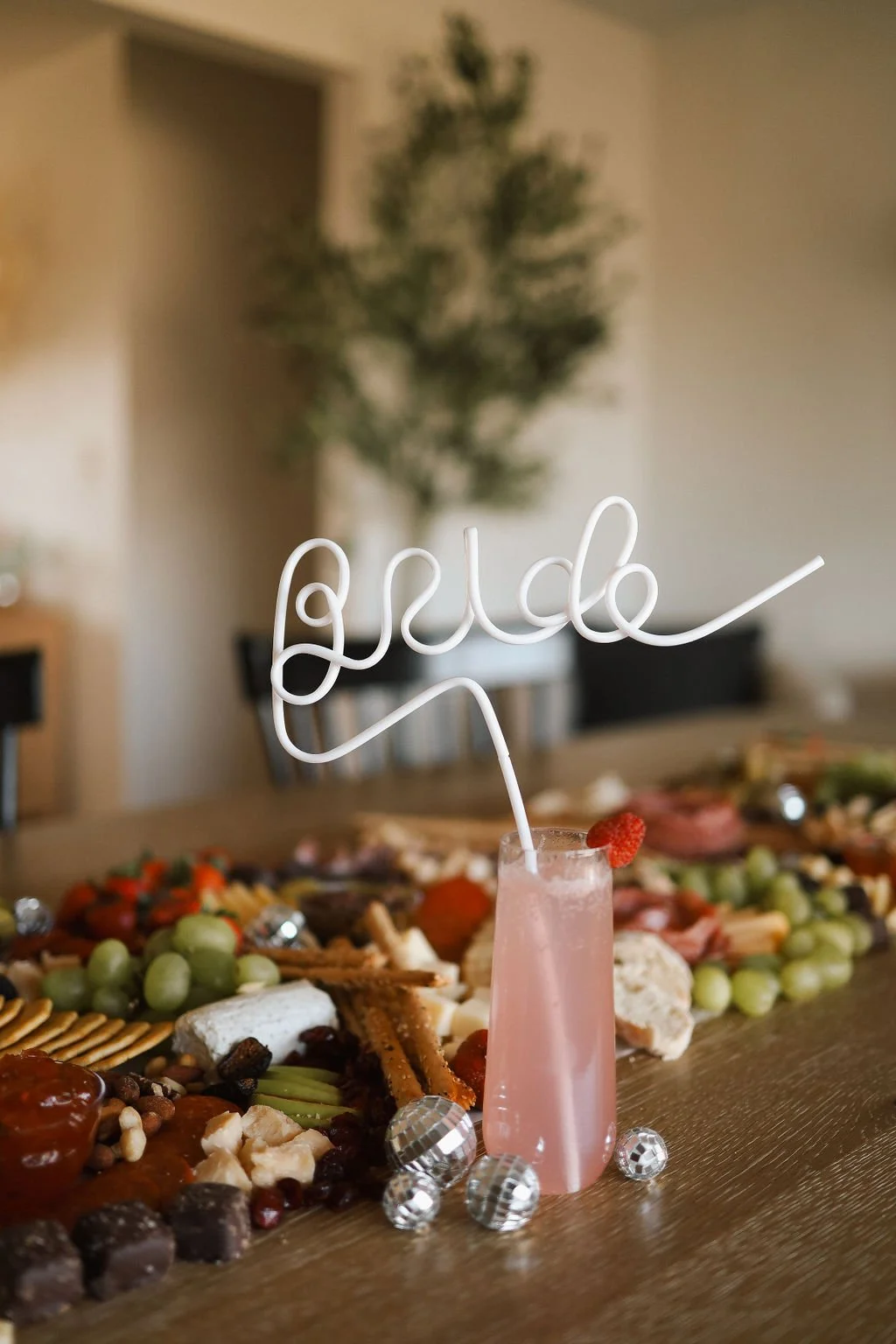 a bride bendy straw in a pink fruity drink