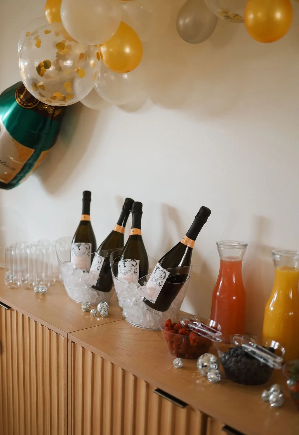 Champagne on ice with various juices
