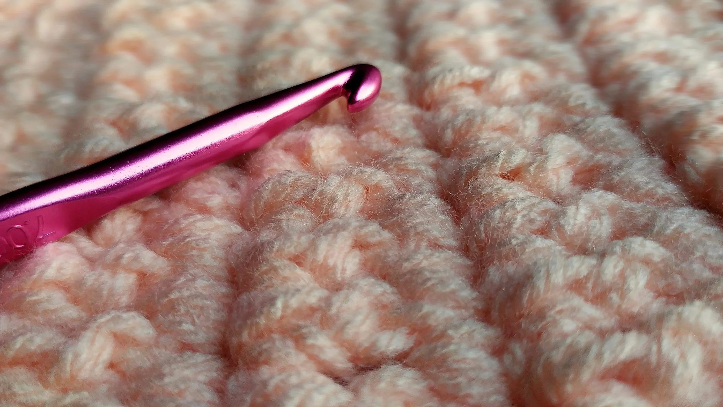 crochet hook with crocheted piece