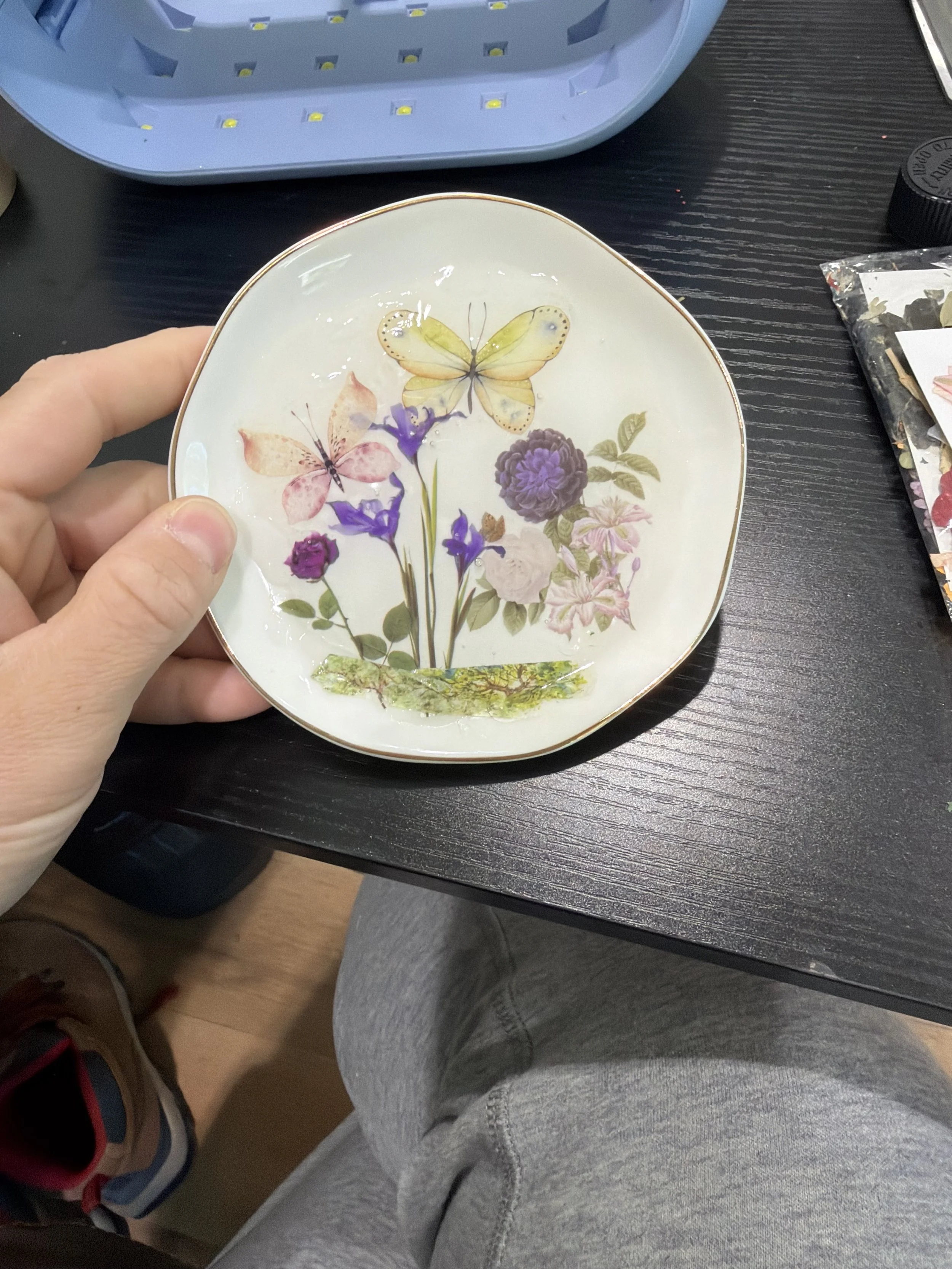 person holding trinket dish
