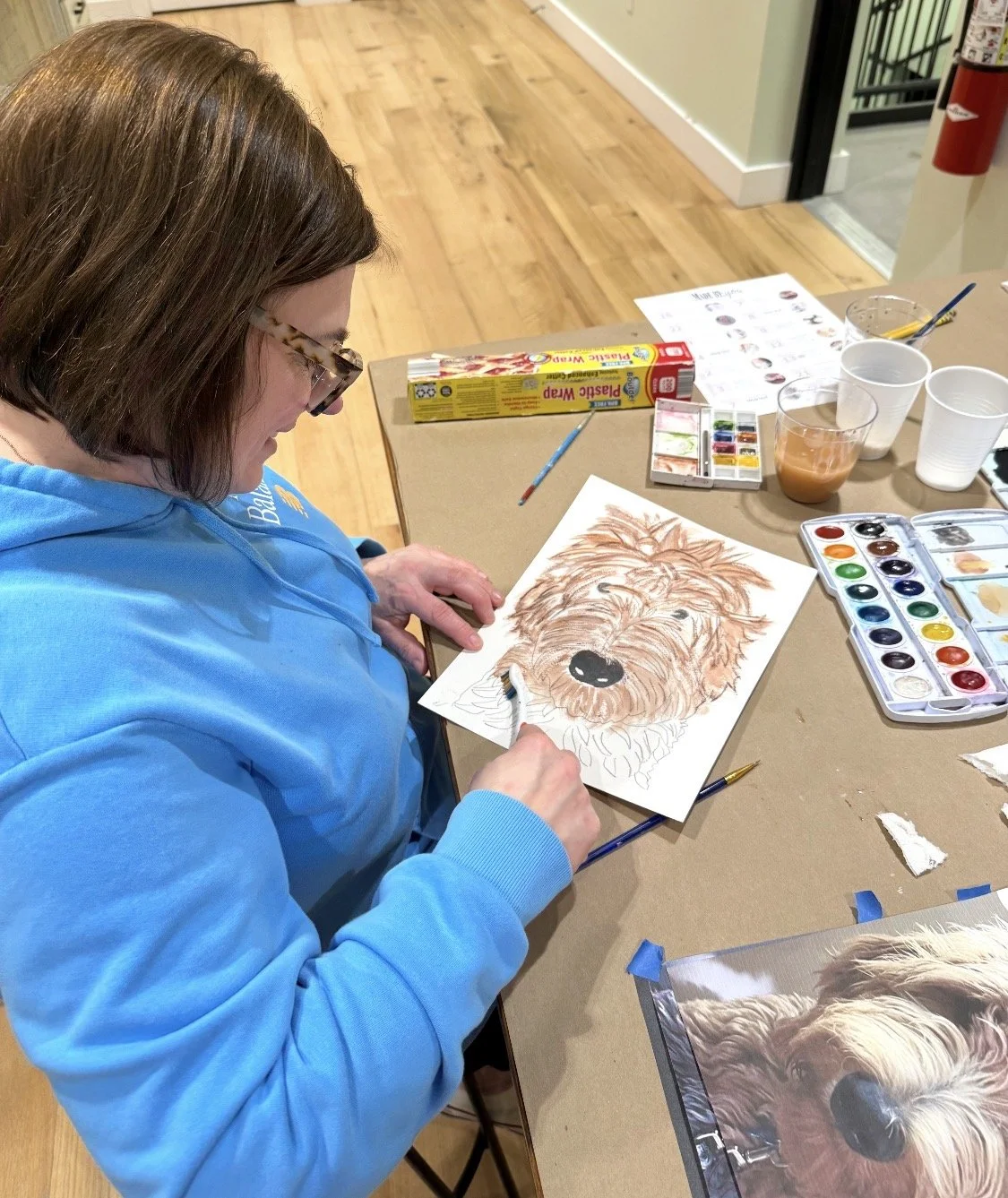 woman painting dog potrait