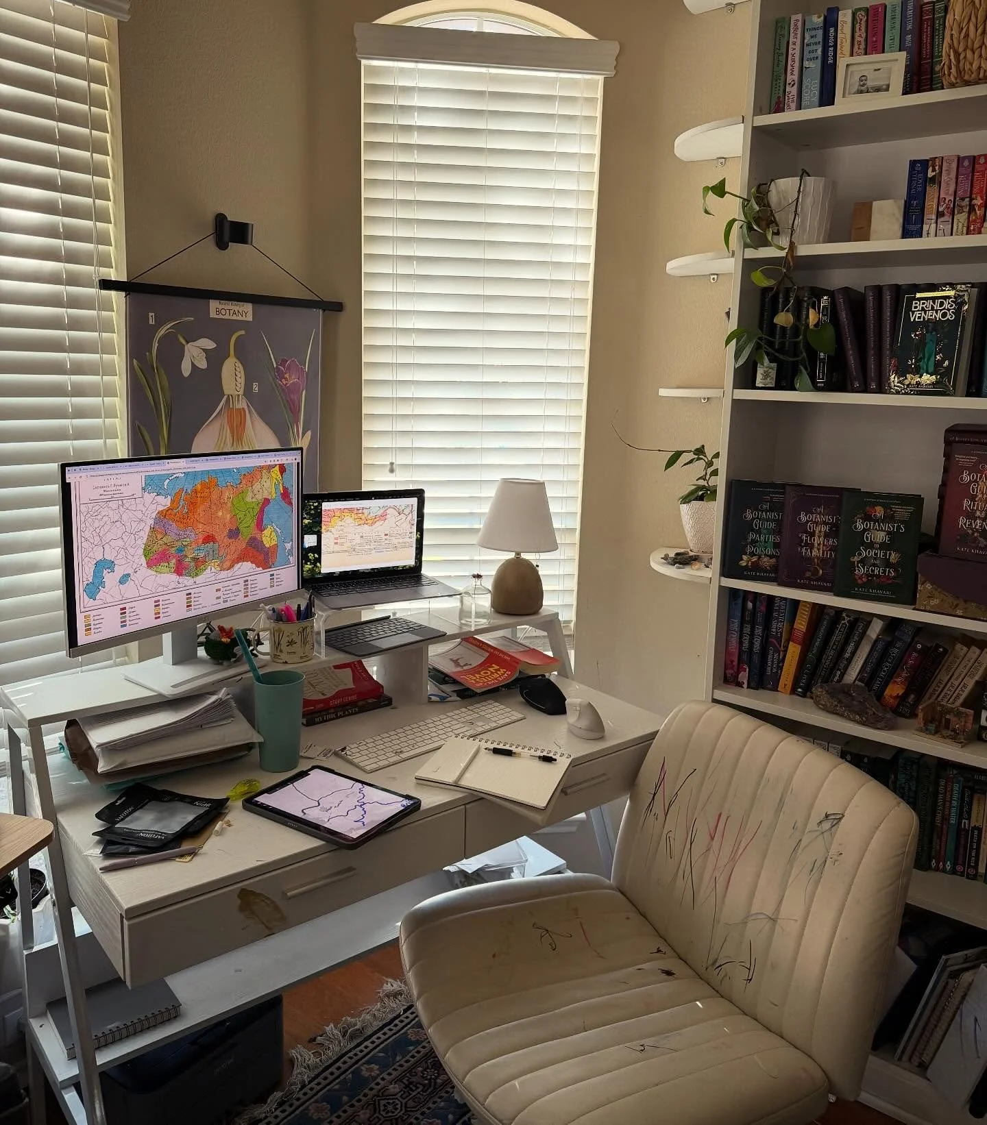 Desk mid world building, empty cups of chai not included. Note the colorful additions to my chair courtesy of the Girl. 

#desksetup #deskspace #authorlife #wfh #wfhlife #desktour #writerslife #writingcommunity