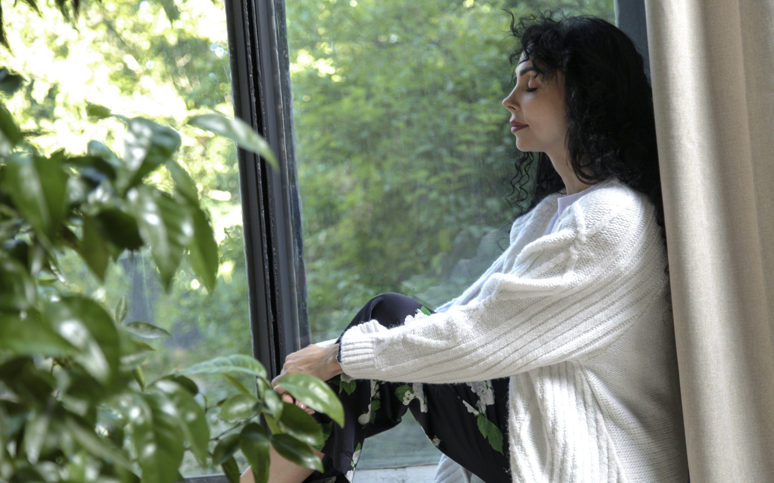 Woman sitting by a window