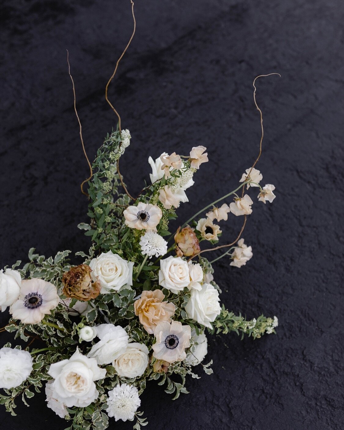 Rainy dayz

Recipe:
-spirea
-anemone 
-curly willow
-sweet pea 
-playa Blanca rose
-scabiosa
-white cloud garden rose
-pittosporum