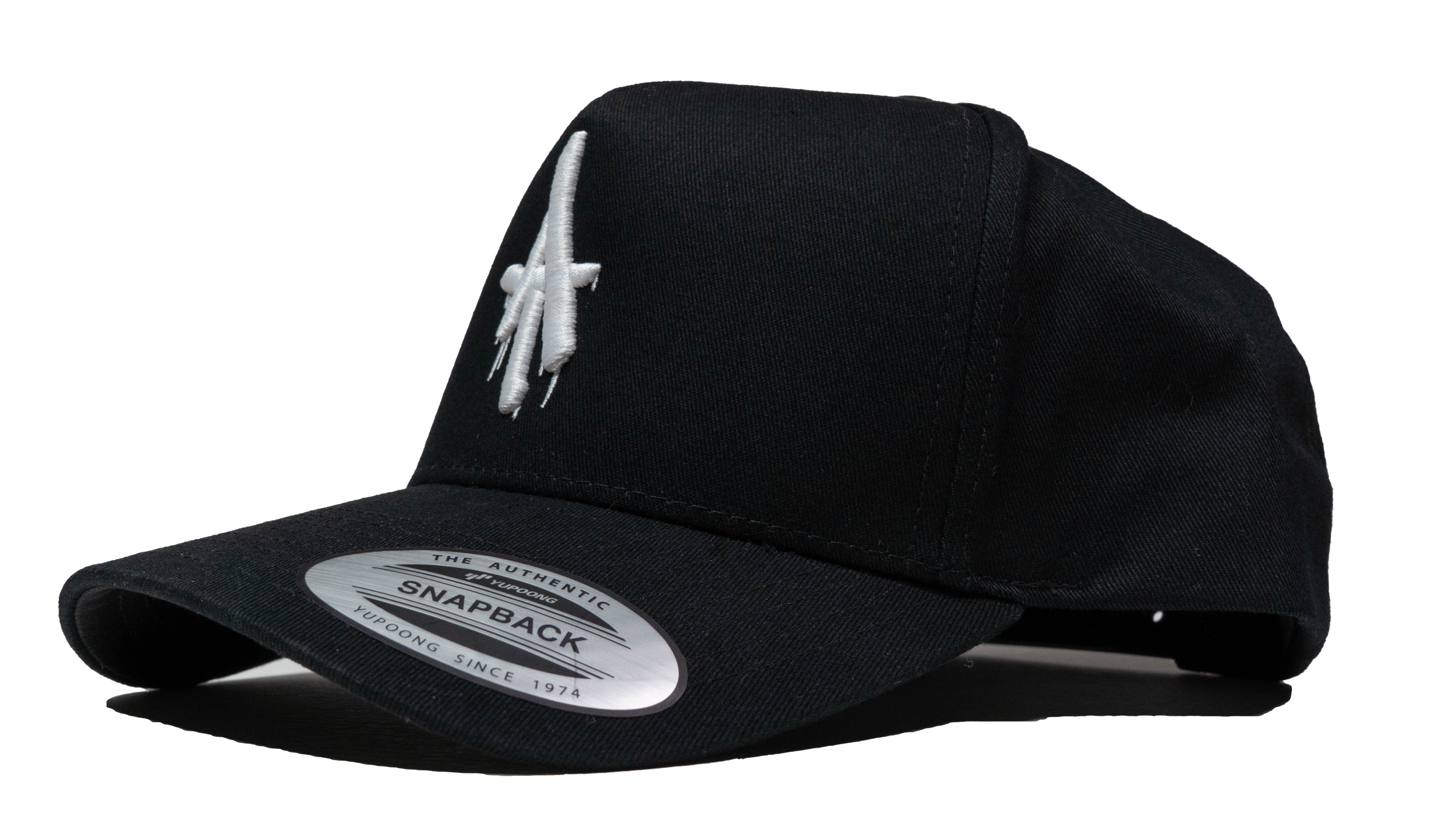 Side view of a black curved-bill snapback hat featuring a white embroidered dripping “AT” logo on the front panel.