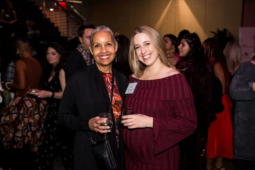 Dr. Michelle Ramos and Jenny Novac posing at an event for a photo
