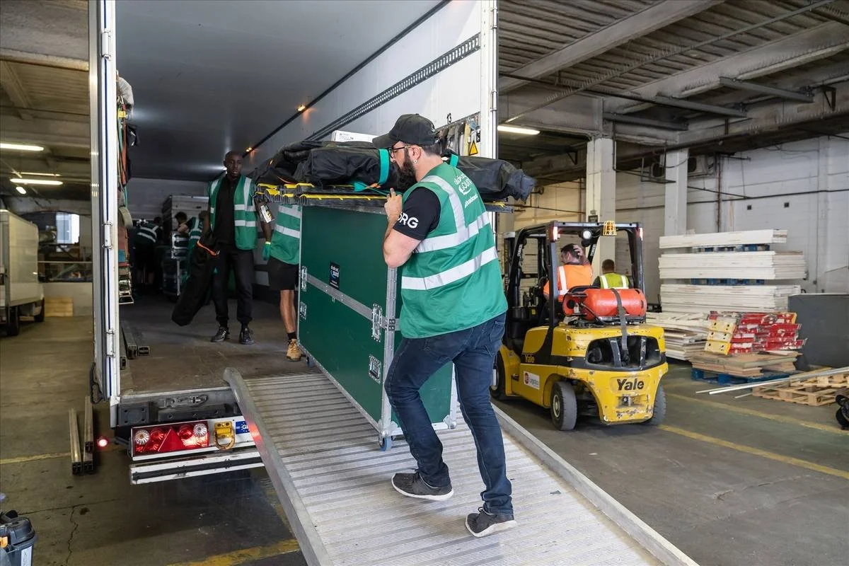 ASAS crew loading flight cases from a truck at the warehouse