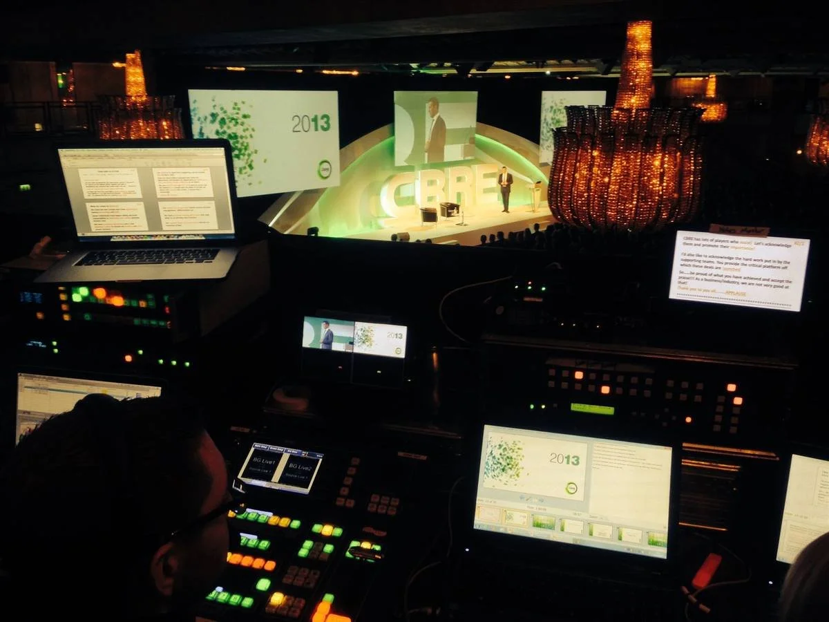 Front-of-house control position with vision mixer, monitors and the stage beyond