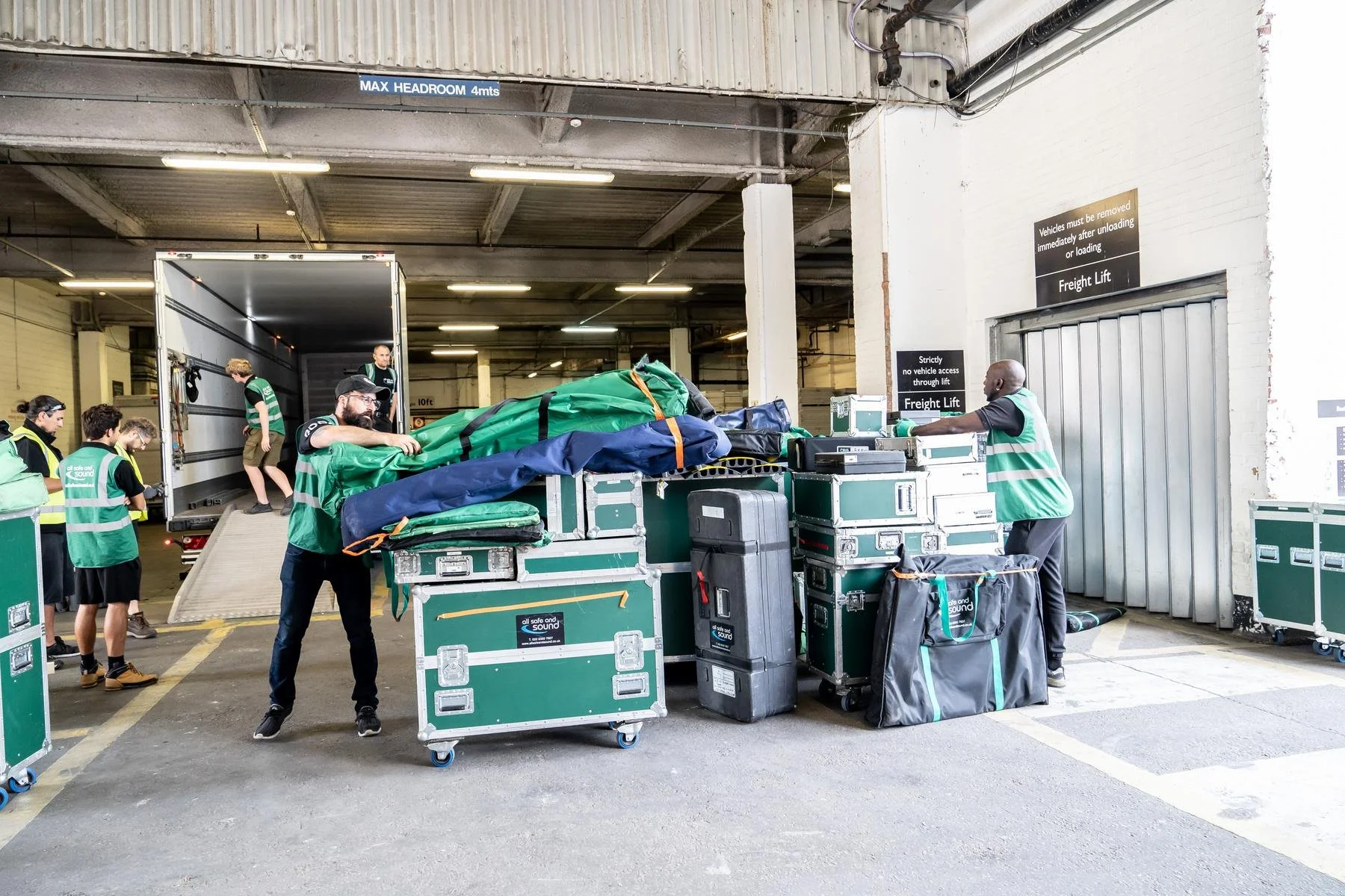 ASAS flight cases stacked at a venue loading dock