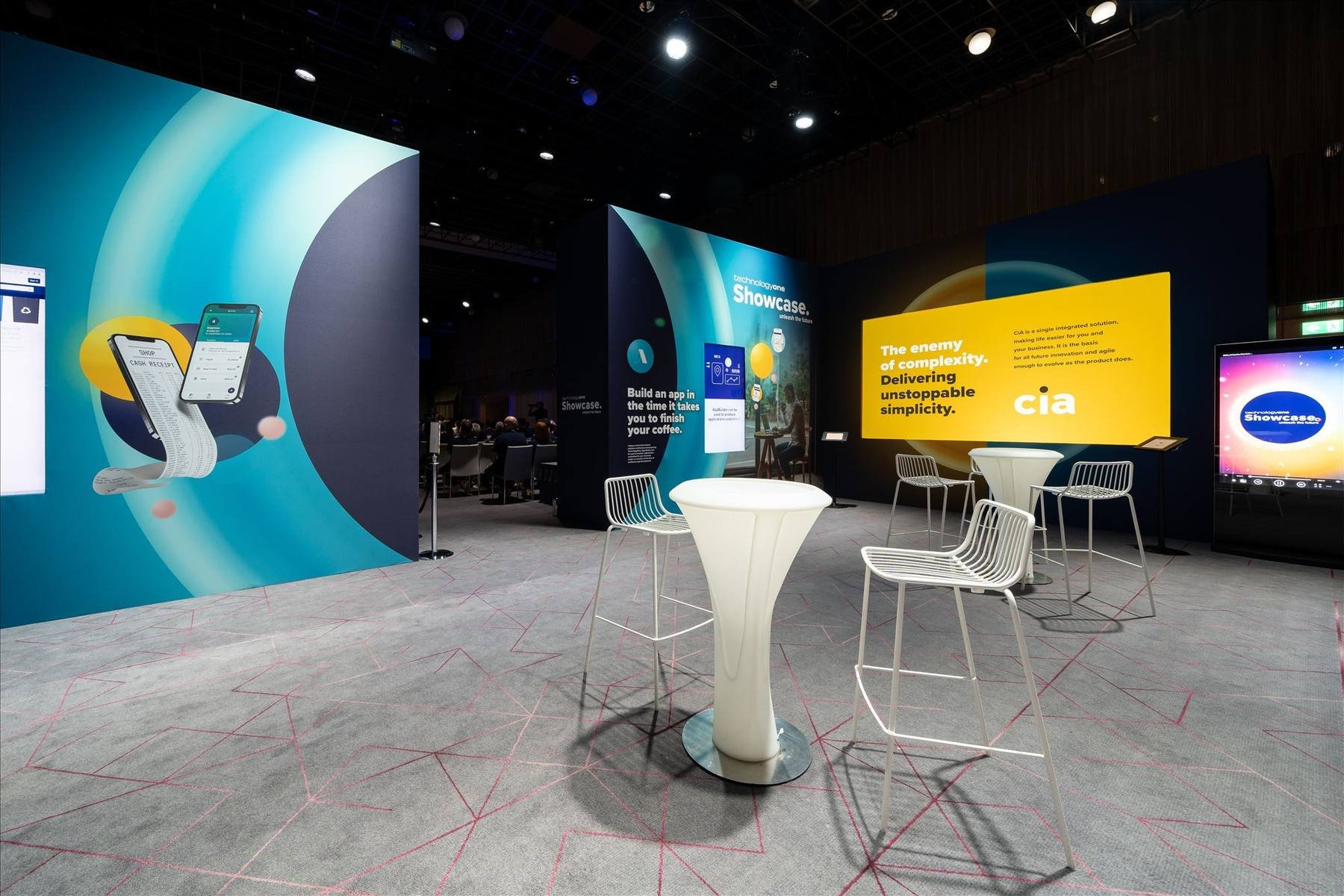 Showcase pods and networking area at the TechnologyOne UK Showcase