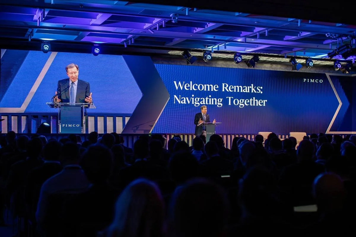 Keynote speaker welcoming a conference audience