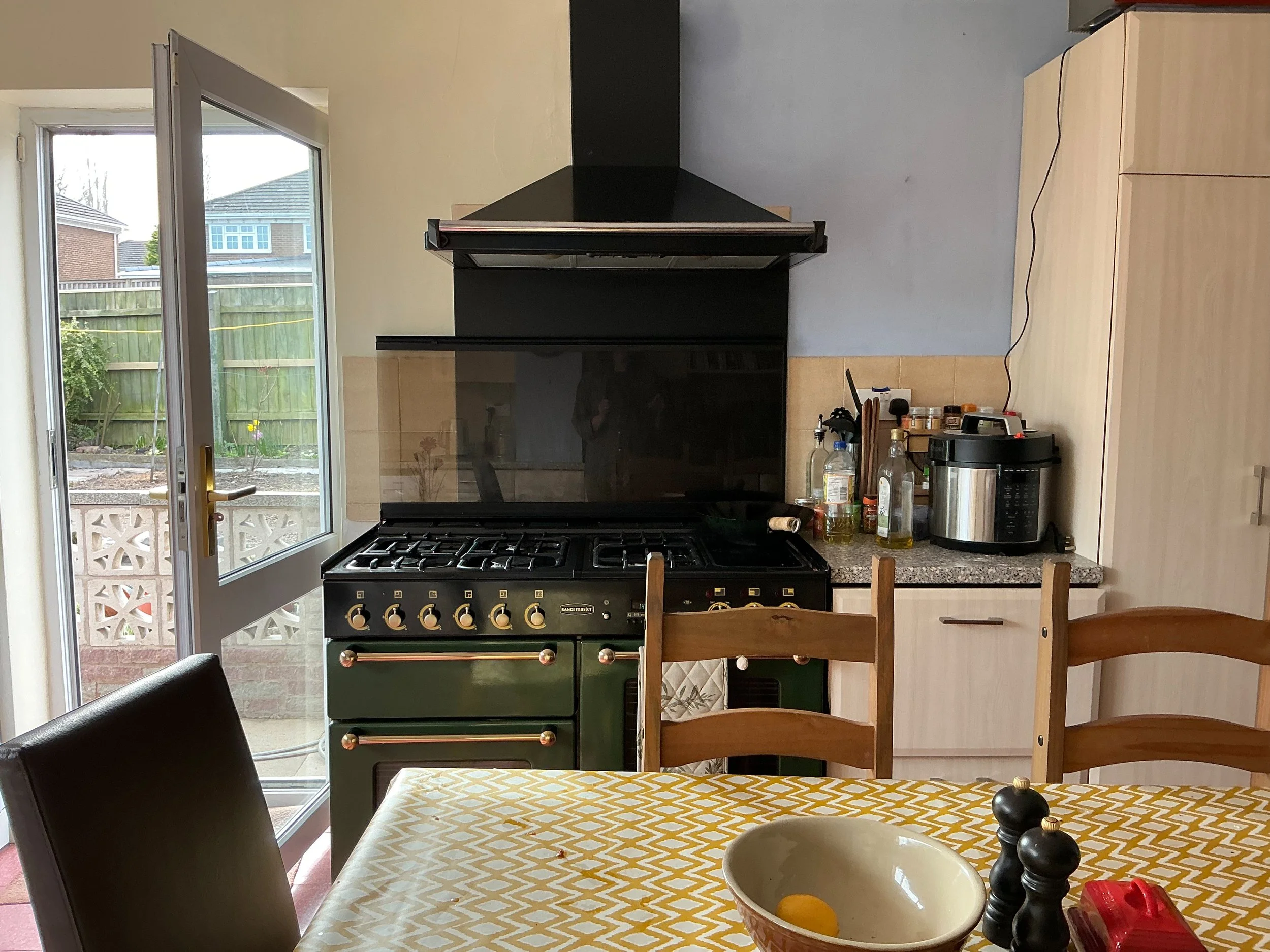 A range cooker in an untidy kitchen