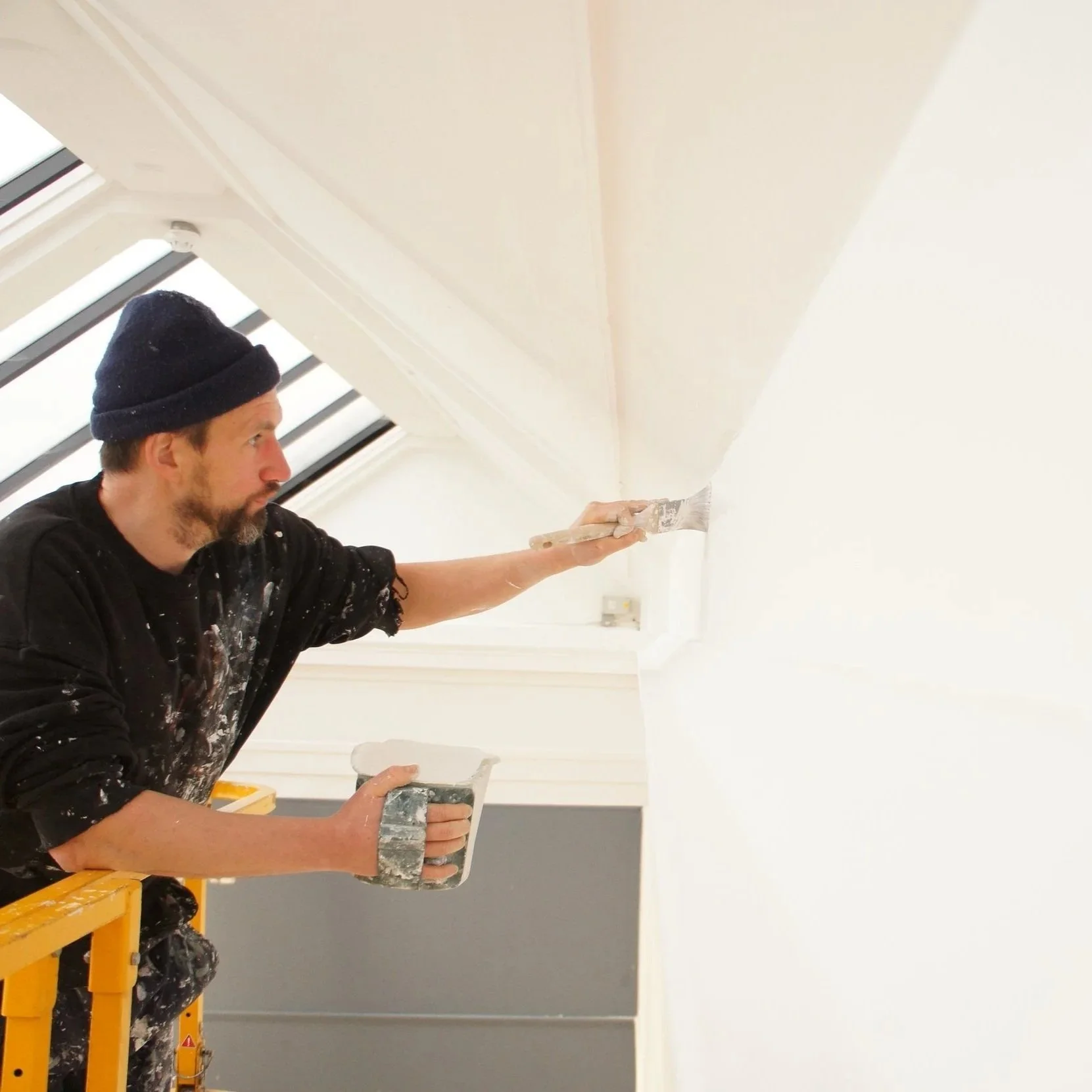 Matthew Timmins-Williams of Emulsional Support painting a room of the Williamson Art Gallery Birkenhead