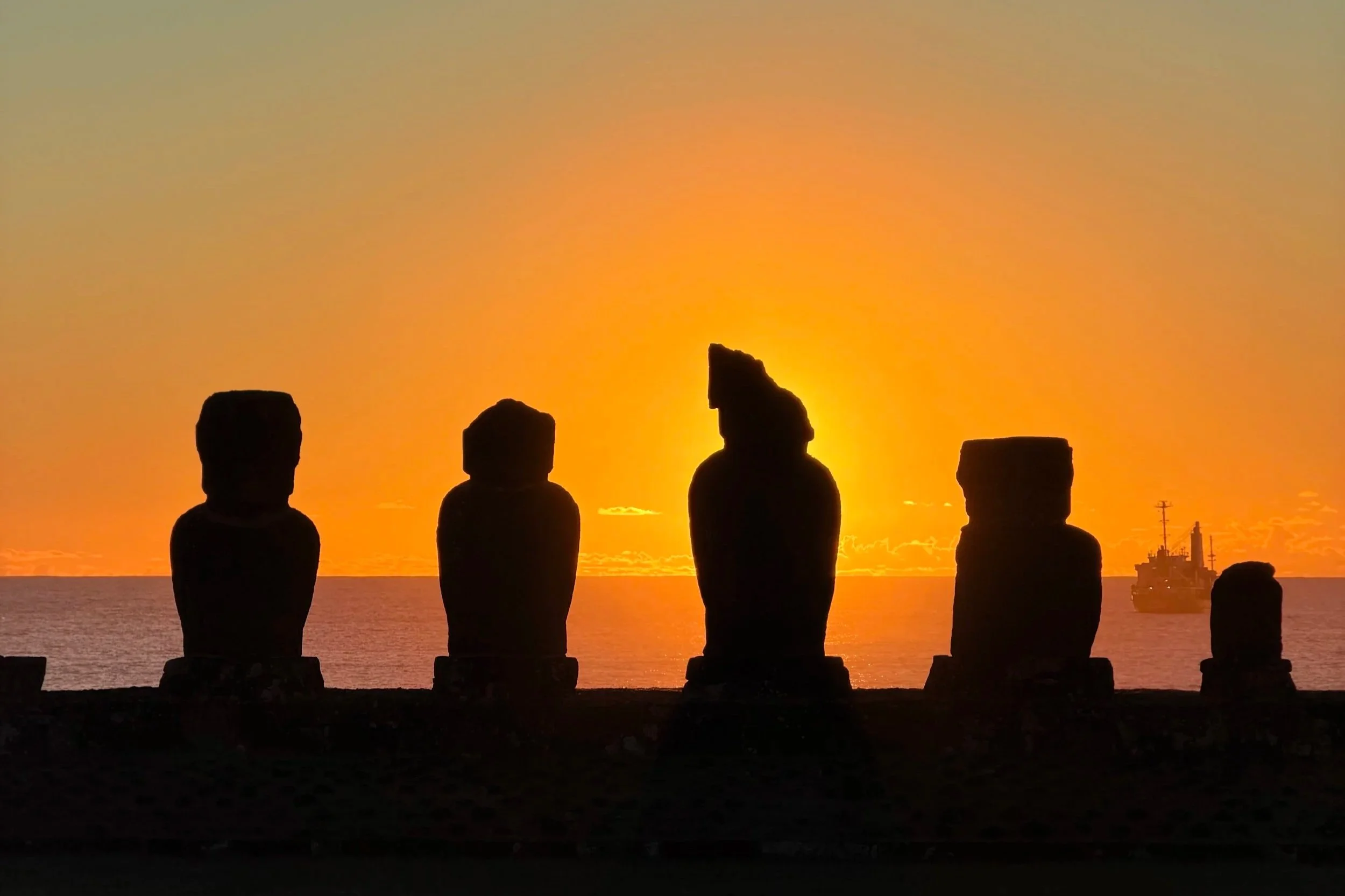 easter island statues at sunset