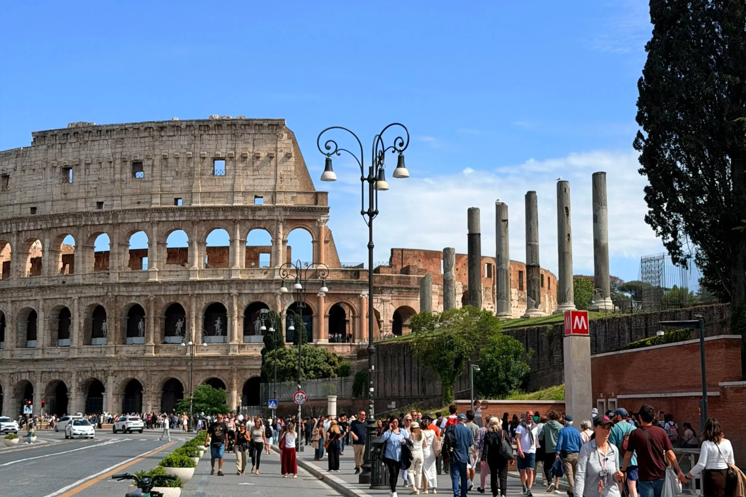 view of colosseum from street in Rome