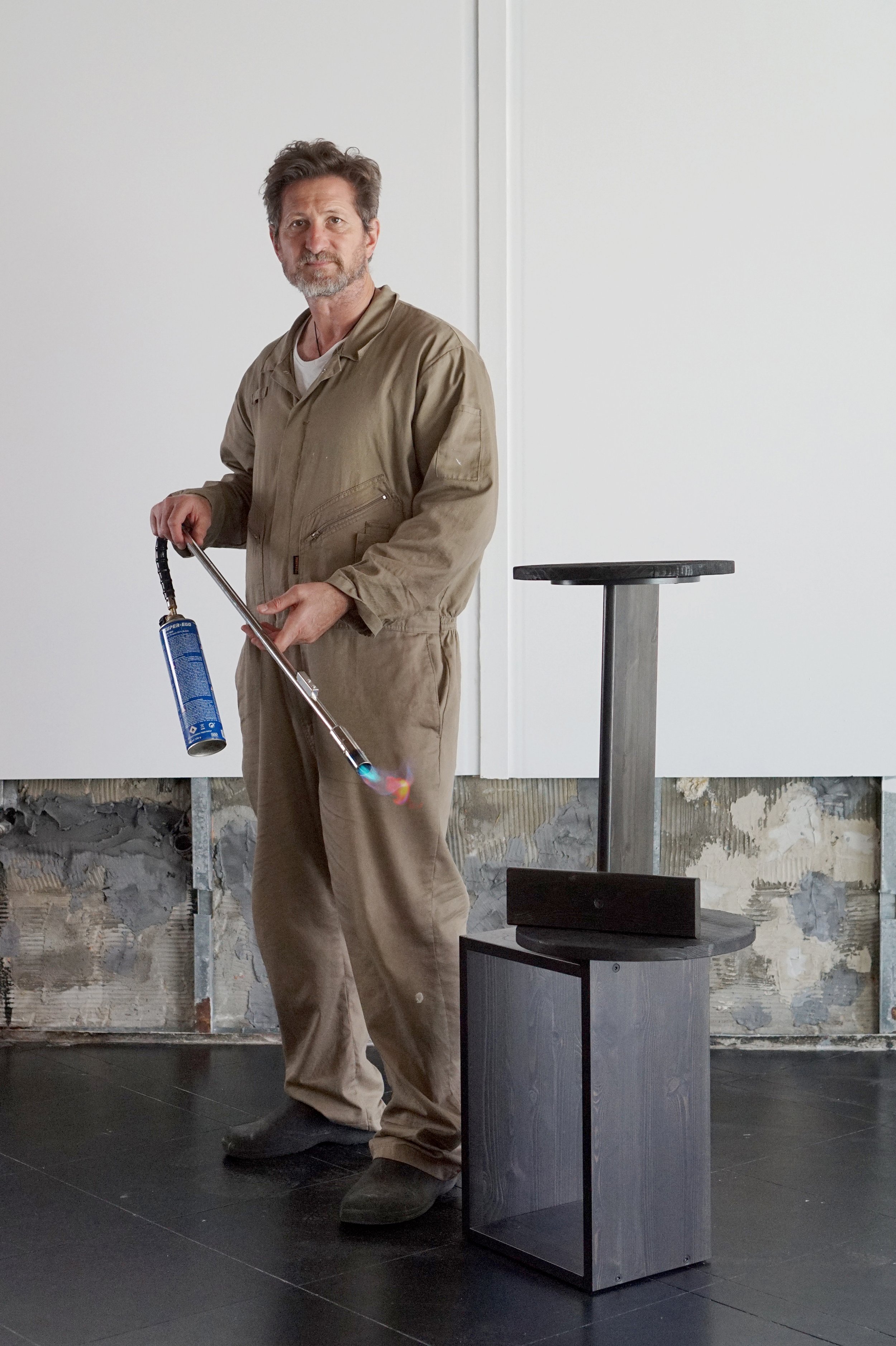 Leonhard Pfeifer with his Otty side table stacked on top of the Margot side table