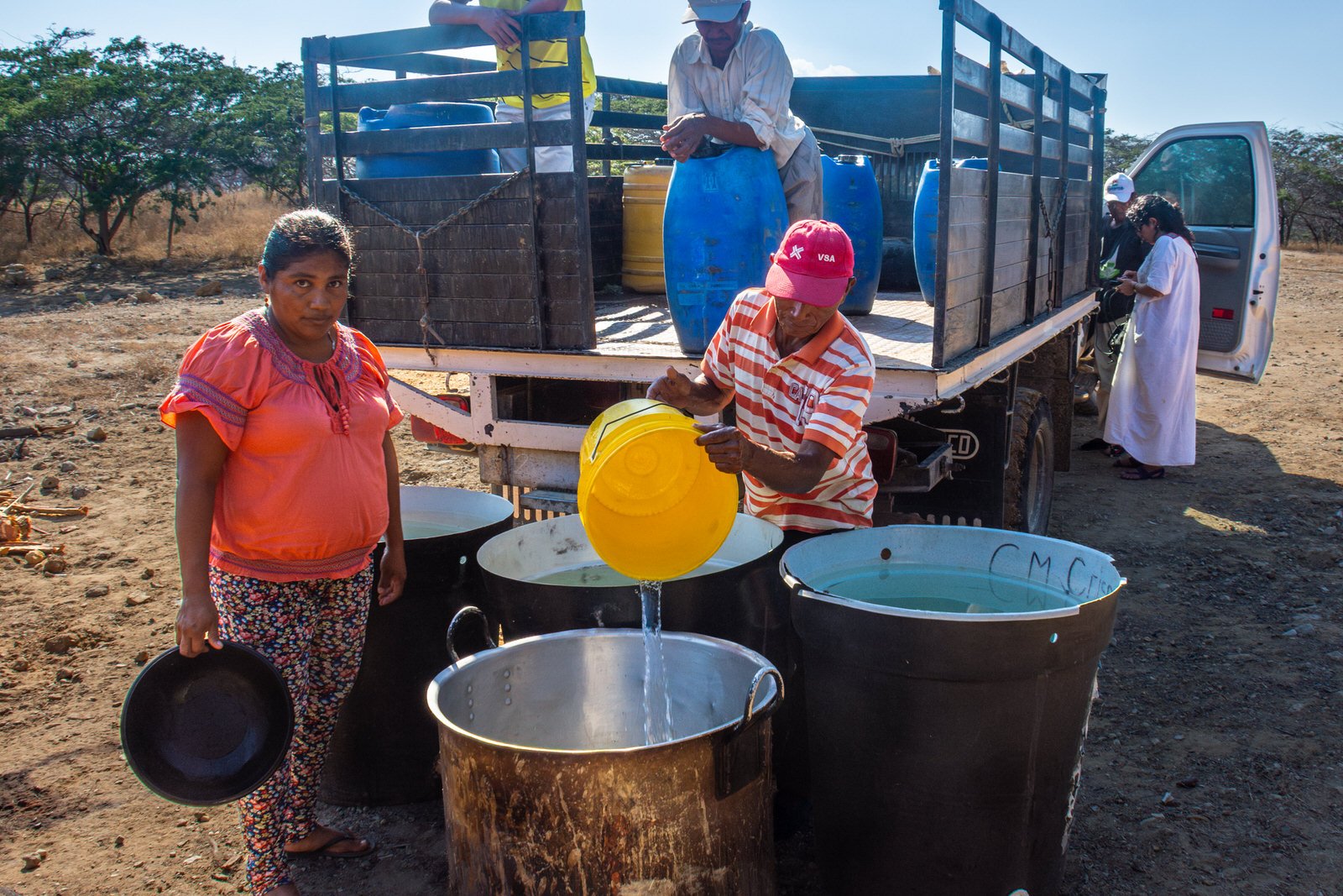 COLOMBIA 2017. Potable water delivery for an Ayulaa funeral gathering, Upper La Guajira.

24 February 2017. Upper La Guajira, Colombia. Potable water is delivered by truck across the desert to supply some 250 attendees of a Wayuu Ayulaa funeral gathe