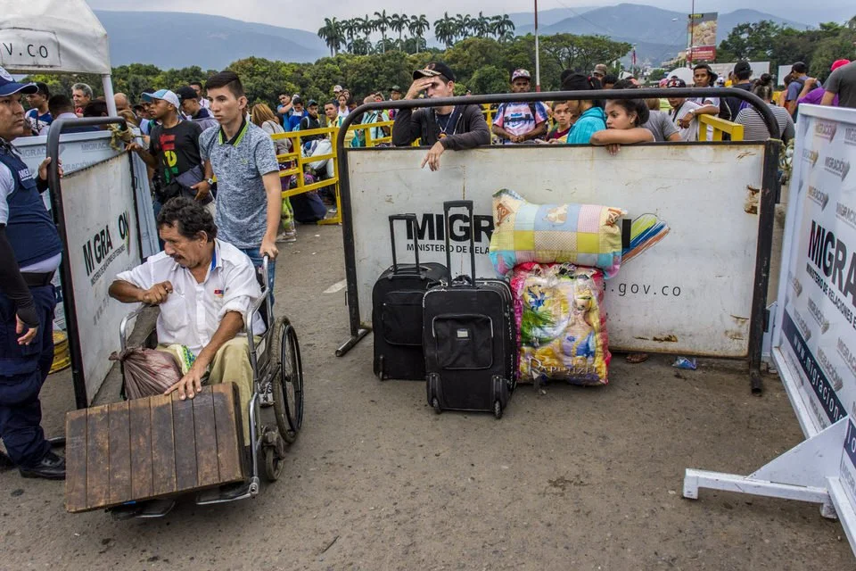 COLOMBIA 2018. Venezuelan migration crisis at the Simón Bolívar International Bridge.

18 April 2018. Simón Bolívar International Bridge, La Parada, Villa del Rosario, Norte de Santander, Colombia. Venezuelan migrants wait alongside their belongings 