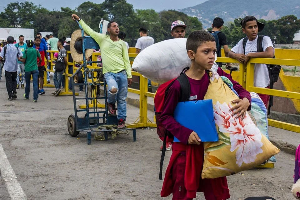 COLOMBIA 2018. Venezuelan migration crisis at the Simón Bolívar International Bridge.

18 April 2018. Simón Bolívar International Bridge, La Parada, Villa del Rosario, Norte de Santander, Colombia. A young Venezuelan boy carries belongings in a pillo
