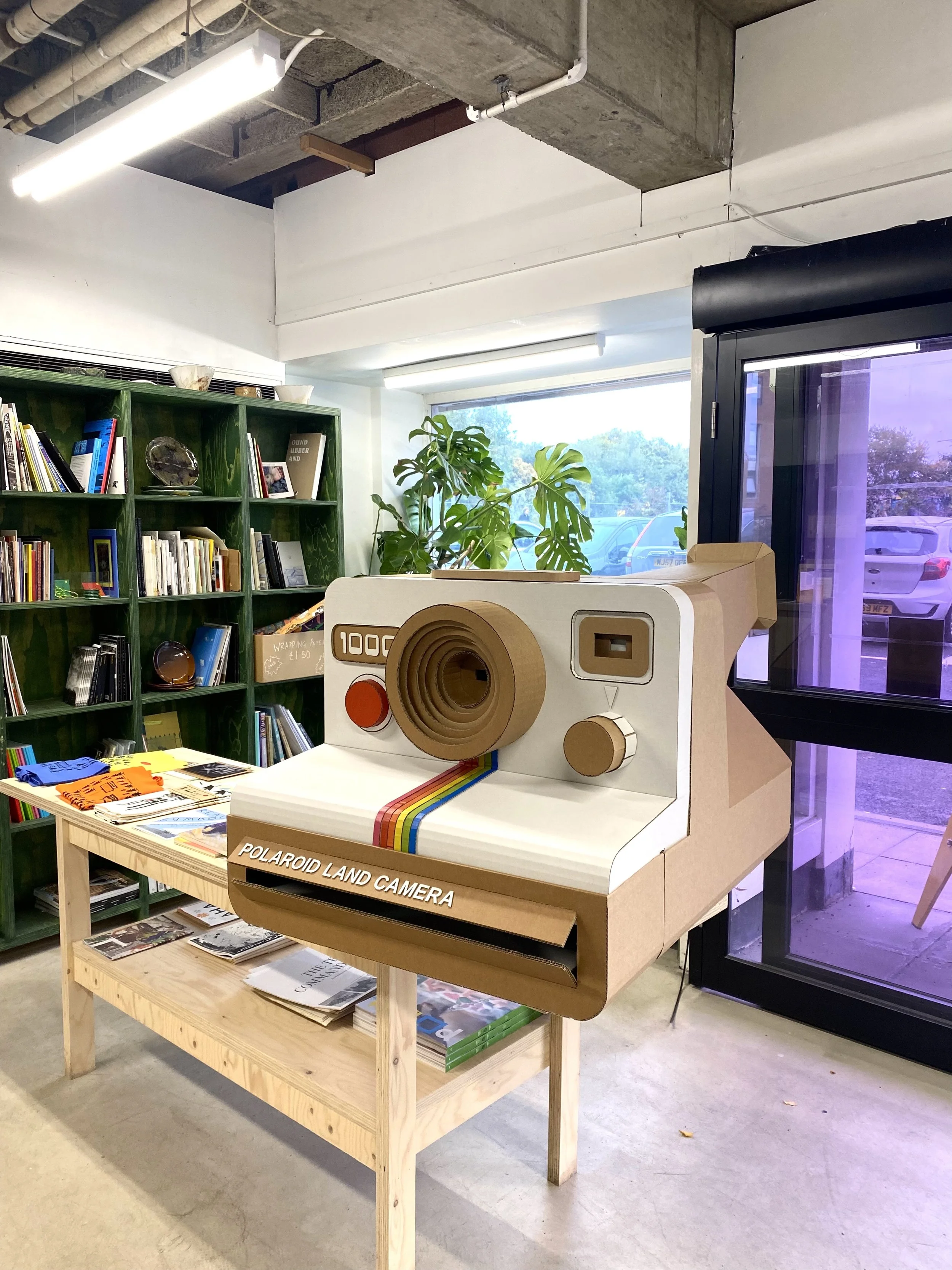 Polaroid Land Camera, Oversized Cardboard Prop Sculpture, shop decor, visual merchandising, environmentally sustainable design, eco friendly advertising, TikTok, Lottie Smith.jpg