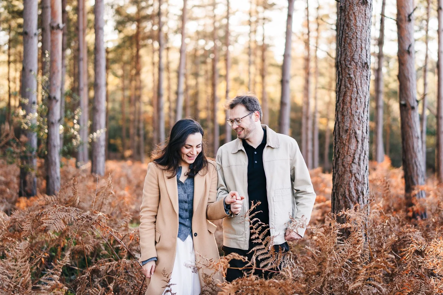 engagement-shoot-couple-walking-laughing-berkshire-candid-wedding-photography.jpg