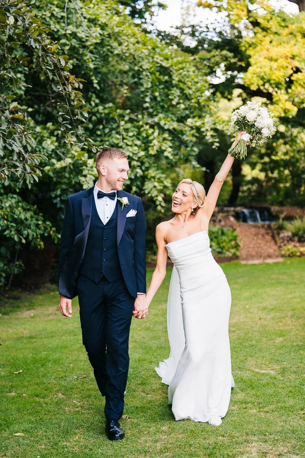 rivervale-barn-wedding-bride-and-groom-bouquet-in-the-air.jpg