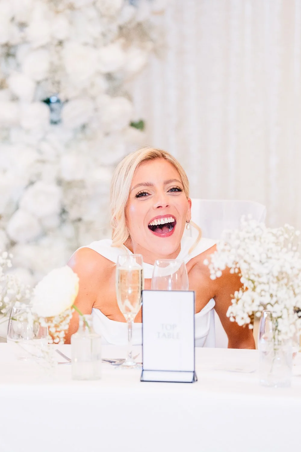 rivervale-barn-berkshire-wedding-bride-laughing-at-speech.jpg