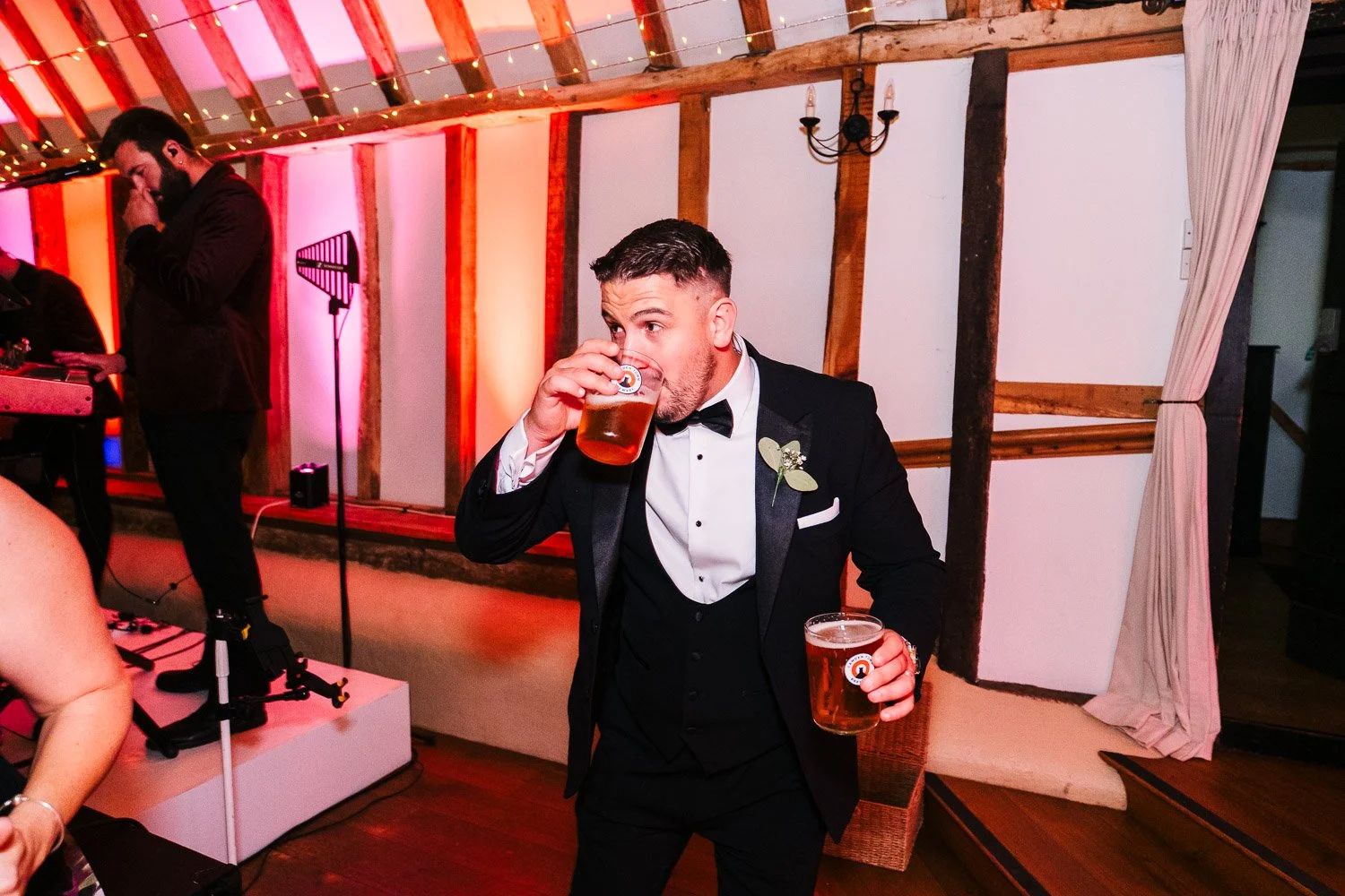 clock-barn-berkshire-wedding-party-groom-with-two-beers.jpg